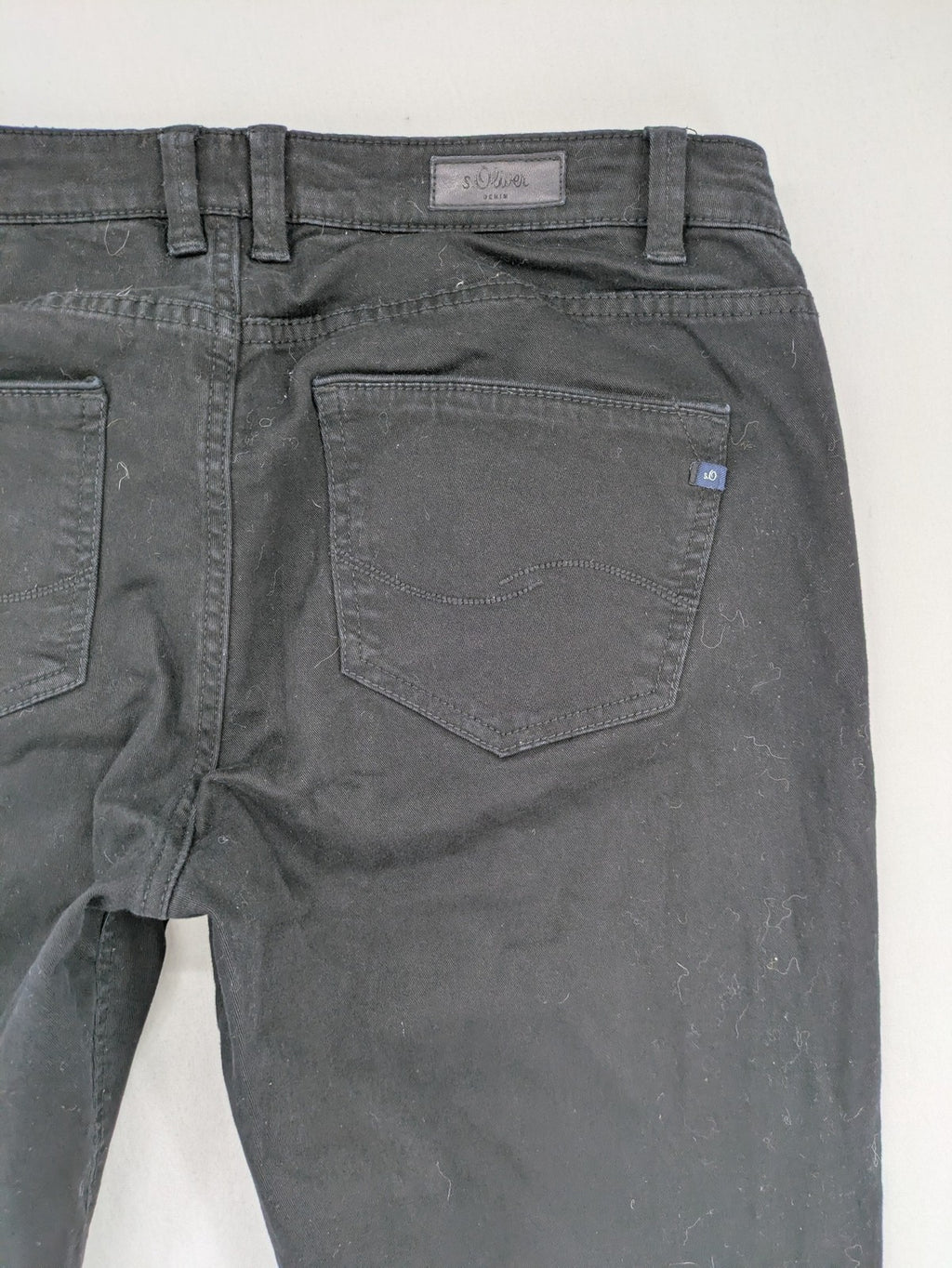s.Oliver black slim fit jeans with low rise and classic design details.