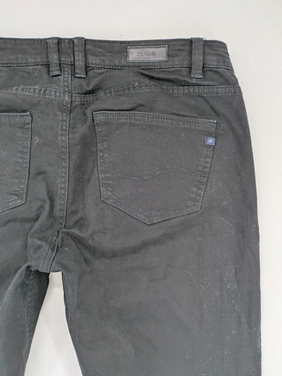 s.Oliver black slim fit jeans with low rise and classic design details.