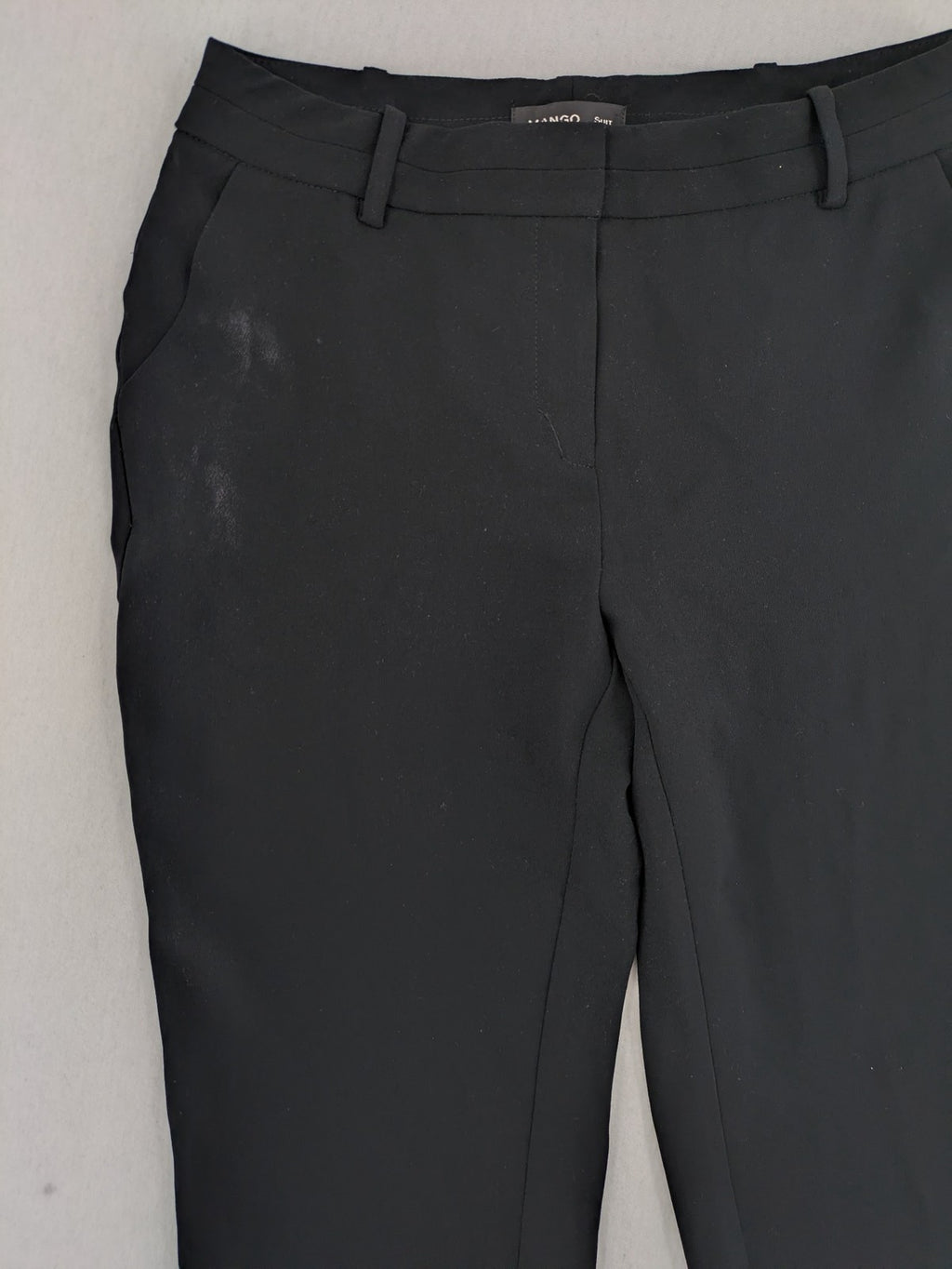 Mango Suit black trousers with zipper, belt loops, and front slant pockets.
