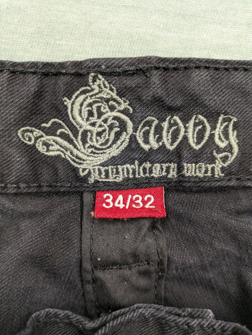 Savvy black pants straight fit with button fly, embroidered details and unique stitching.