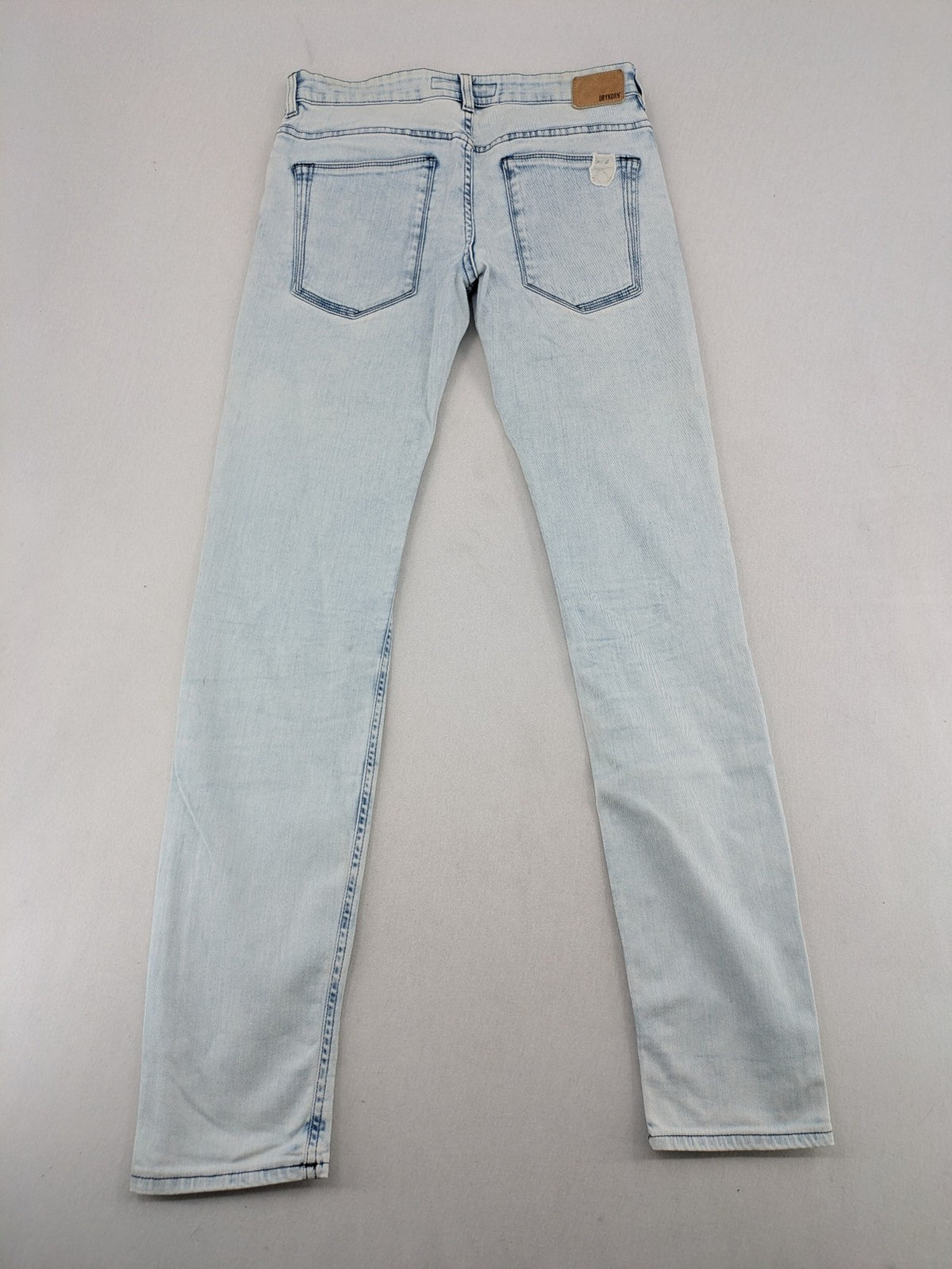 Drykorn blue slim fit jeans with acid wash and leather logo patch.