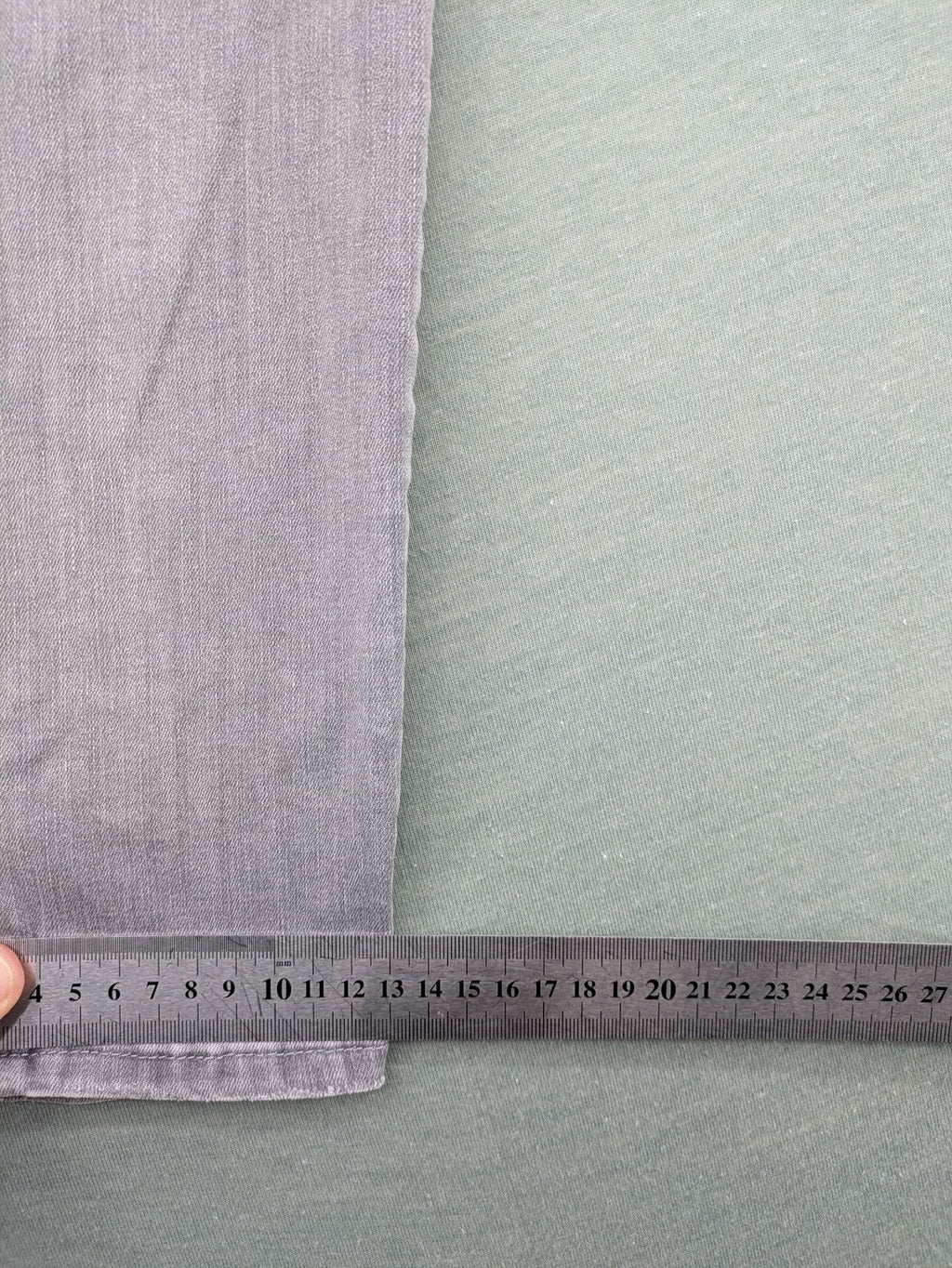 H&M grey super skinny jeans with distressed knee details and low waist fit.