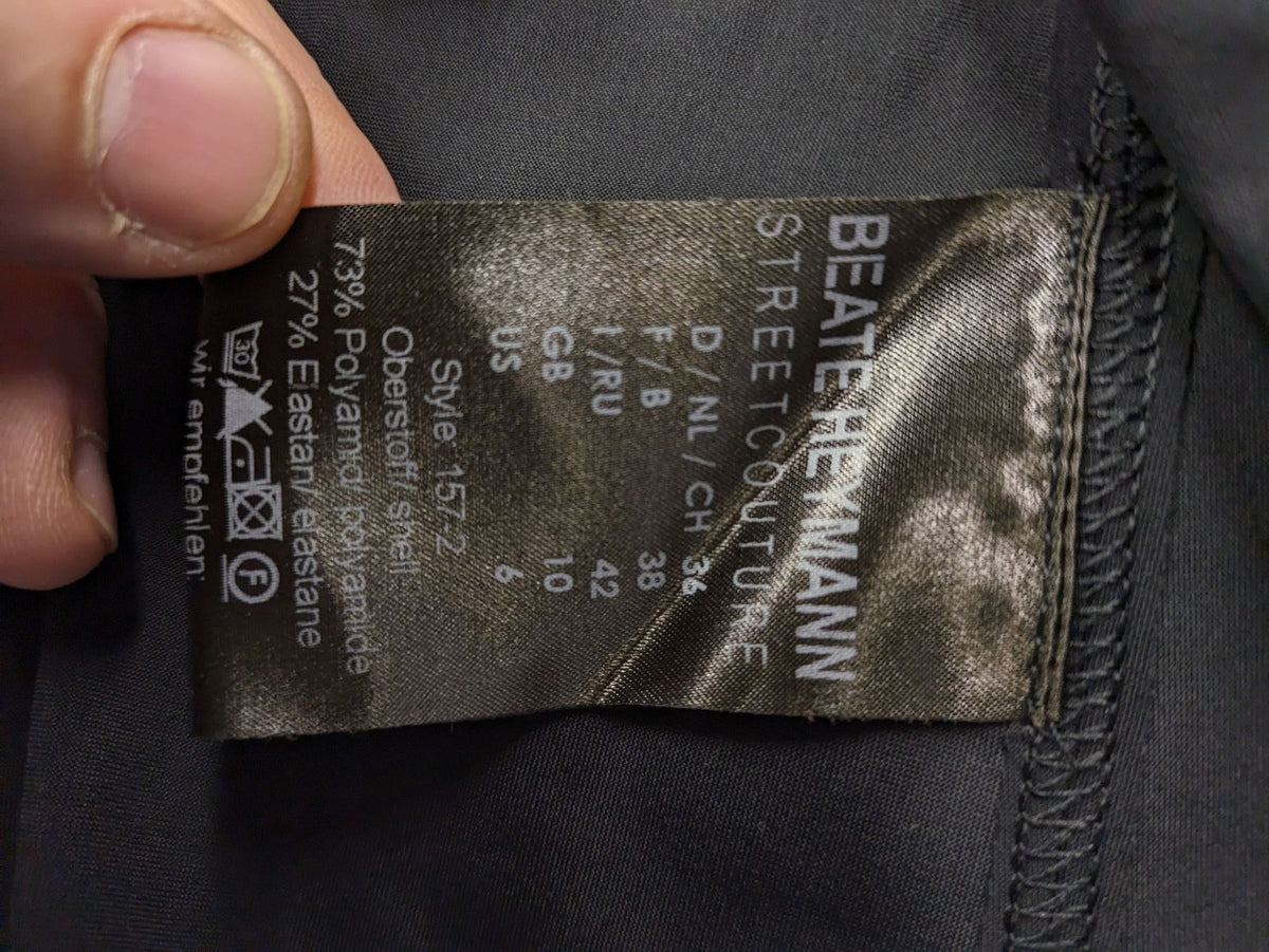 Beate Heymann black biker jacket with asymmetrical front and stand-up collar, stretch material.