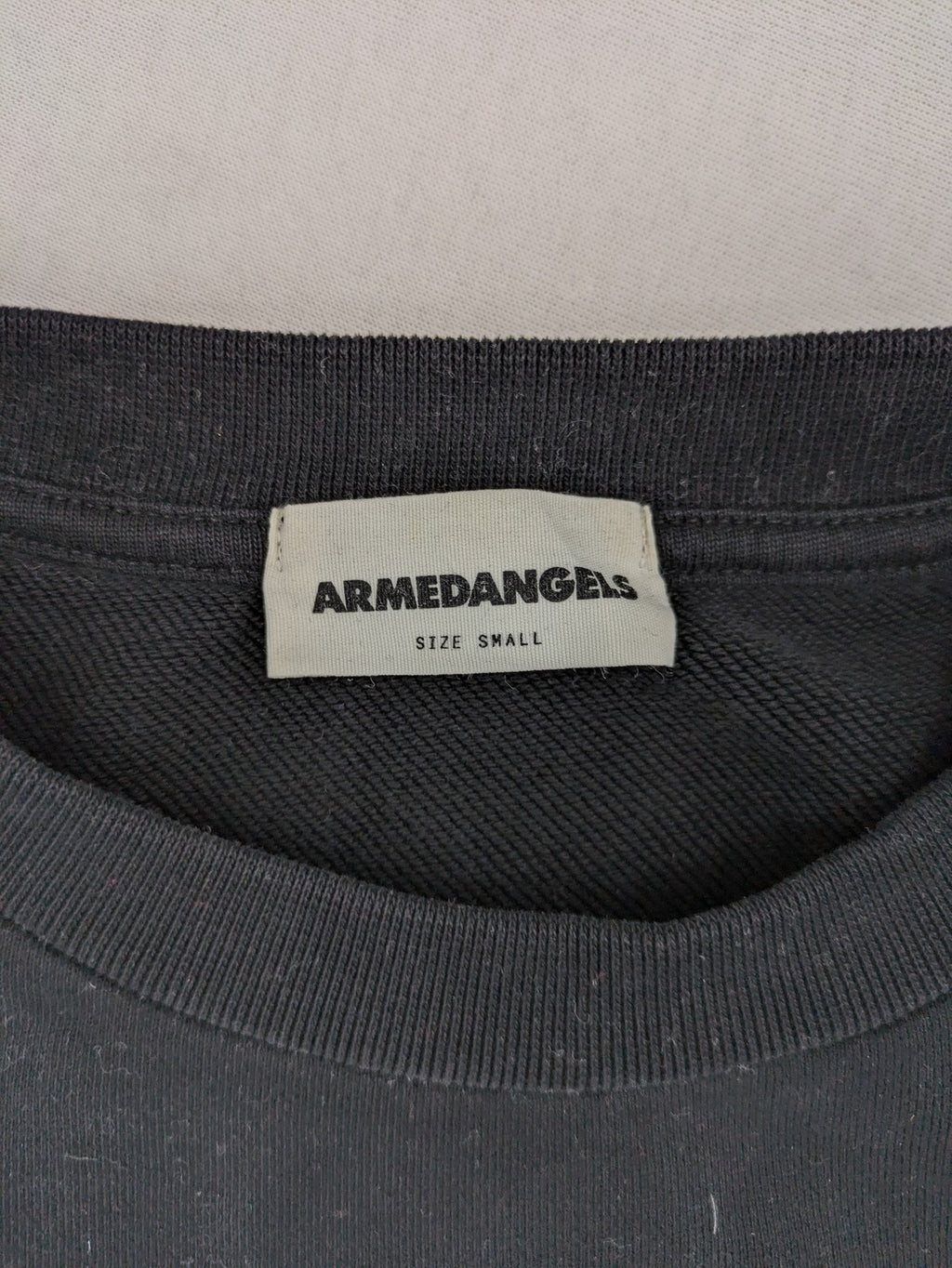 Armedangels black turtle neck jumper with embroidered logo, made from 100% organic cotton.
