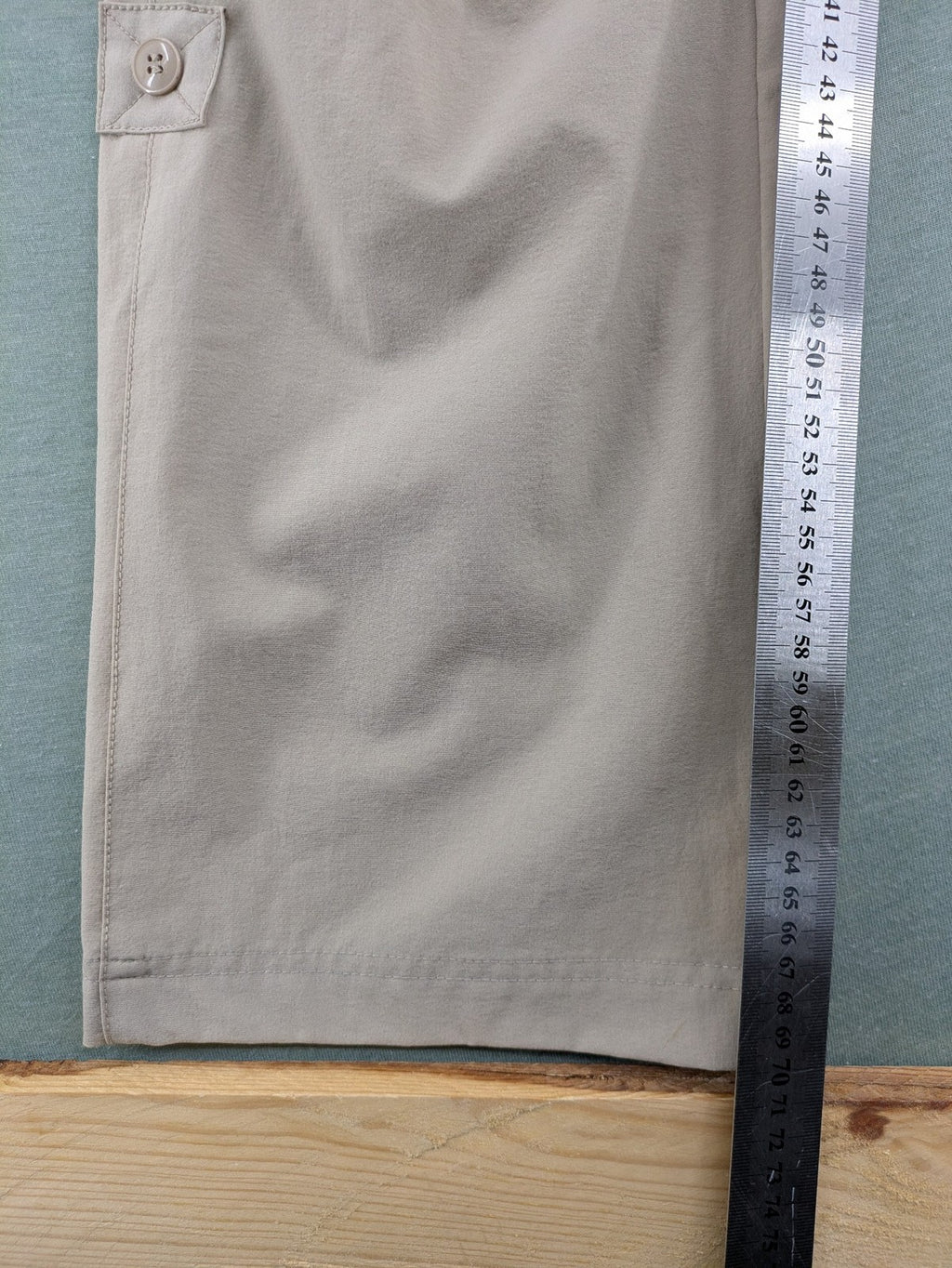 Hickory beige outdoor pants with multiple zippered pockets and stretch fabric for comfort.