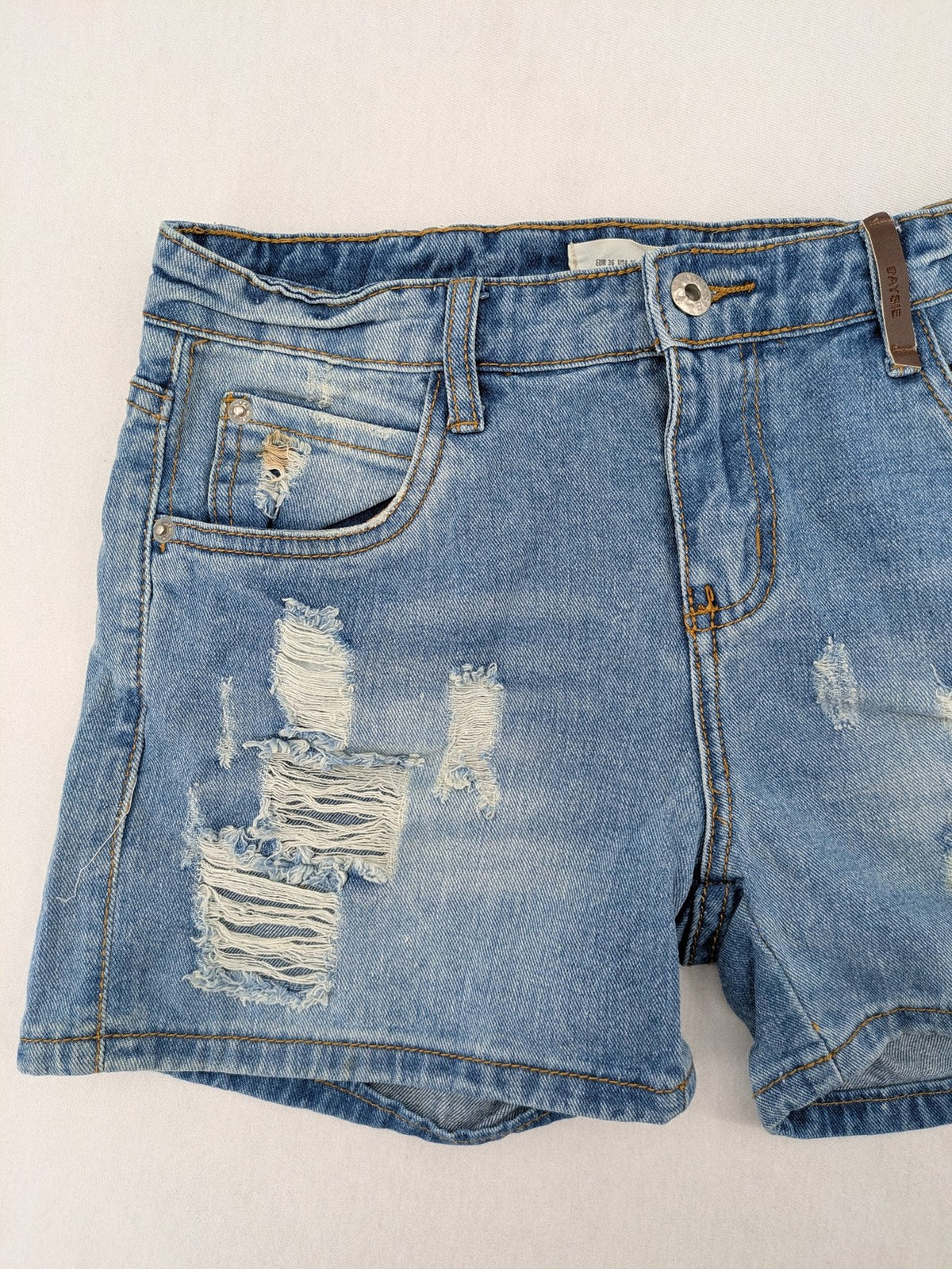 Daysie blue boyfriend jeans shorts with distressed rips and classic 5-pocket design.