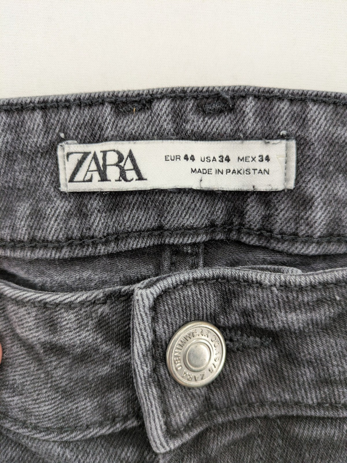 Zara black straight jeans faded wash five-pocket design with zipper closure.