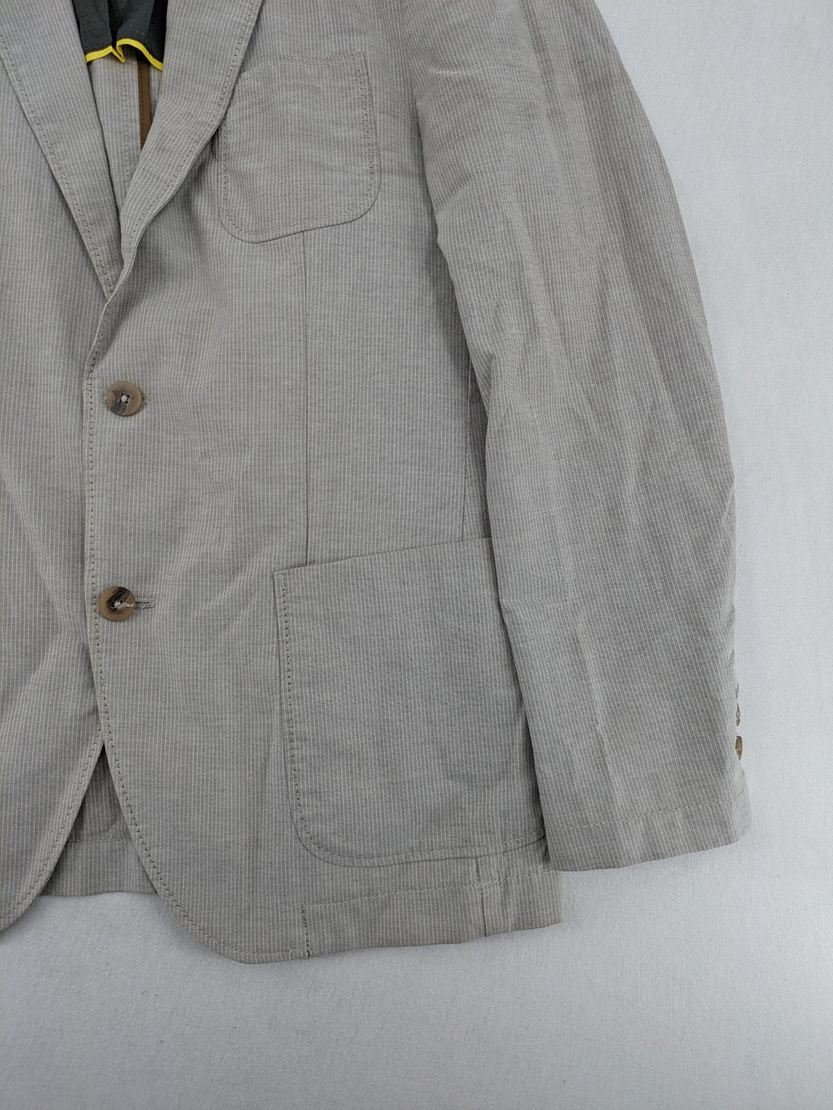 Camel Active grey cord blazer with classic two-button closure and practical zippered inner pockets.