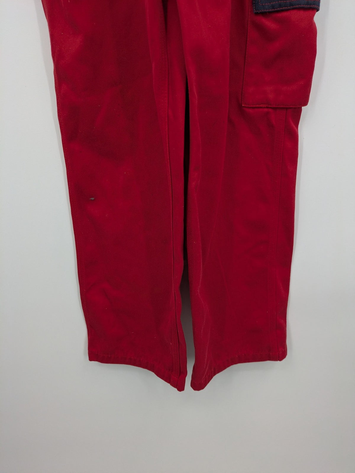 Grene navy red overall with adjustable straps, multiple pockets, and durable material.