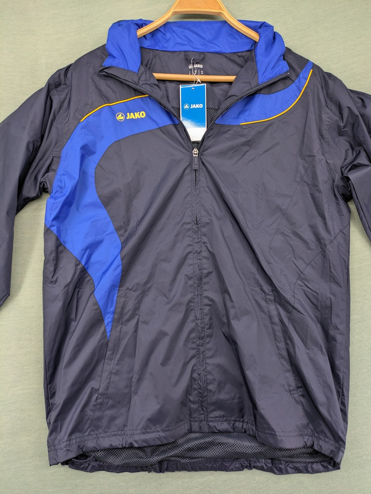 Jako navy windbreaker full zip jacket with breathable mesh lining and logo details.