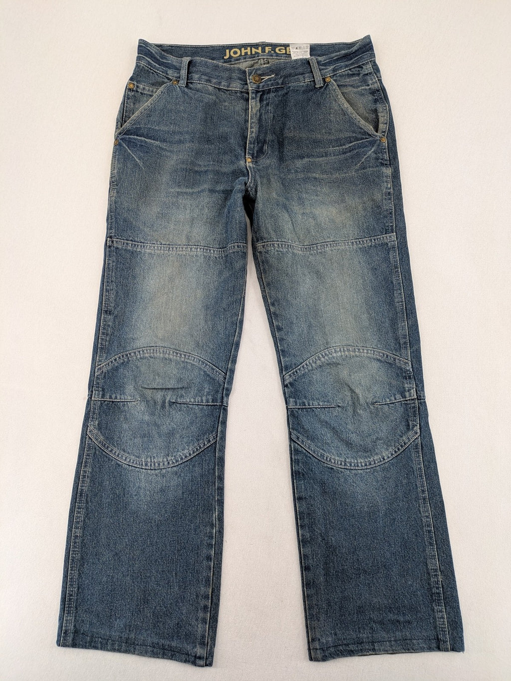 John F. Gee blue straight jeans with reinforced knees and durable denim material.