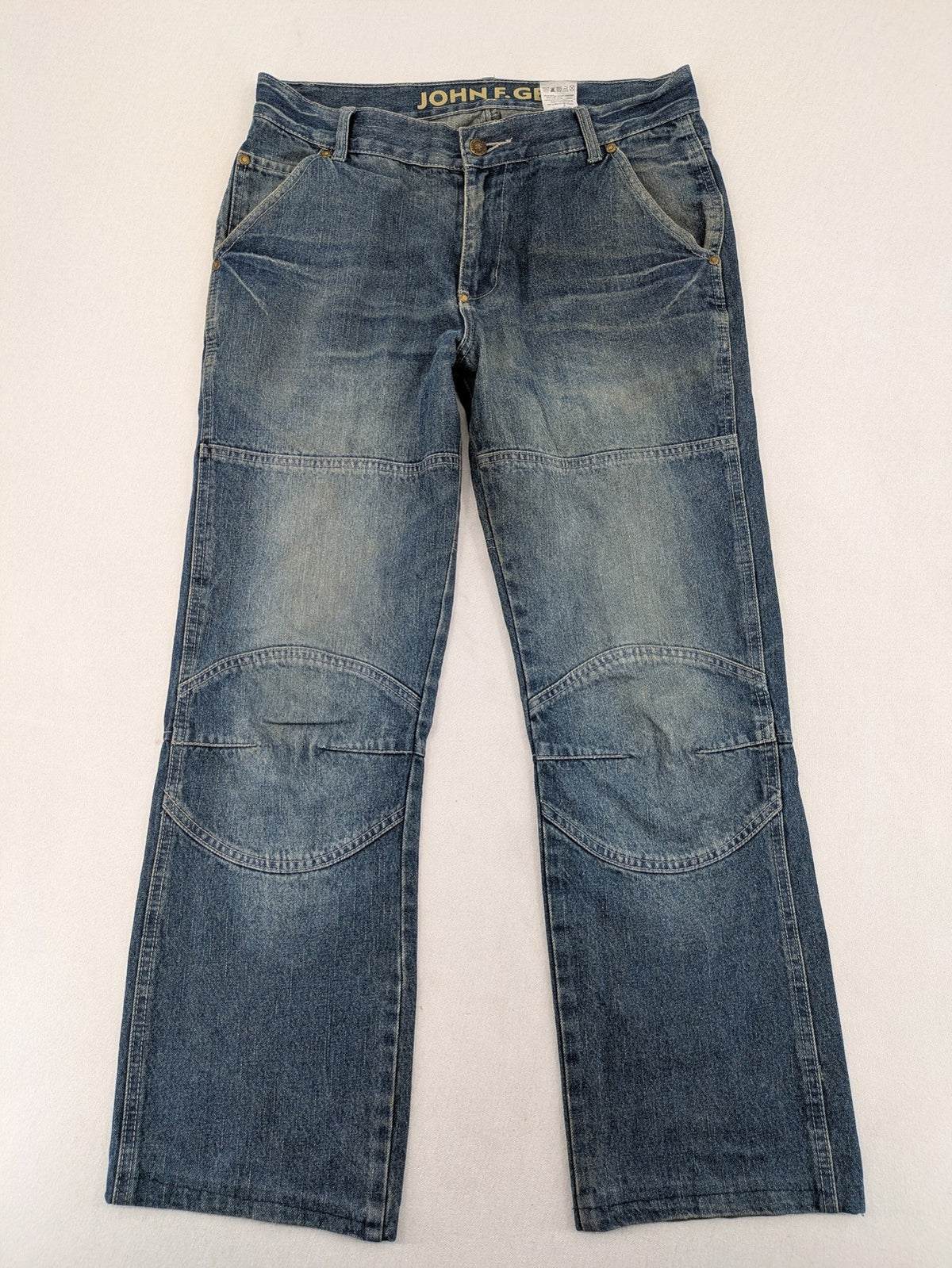 John F. Gee blue straight jeans with reinforced knees and durable denim material.
