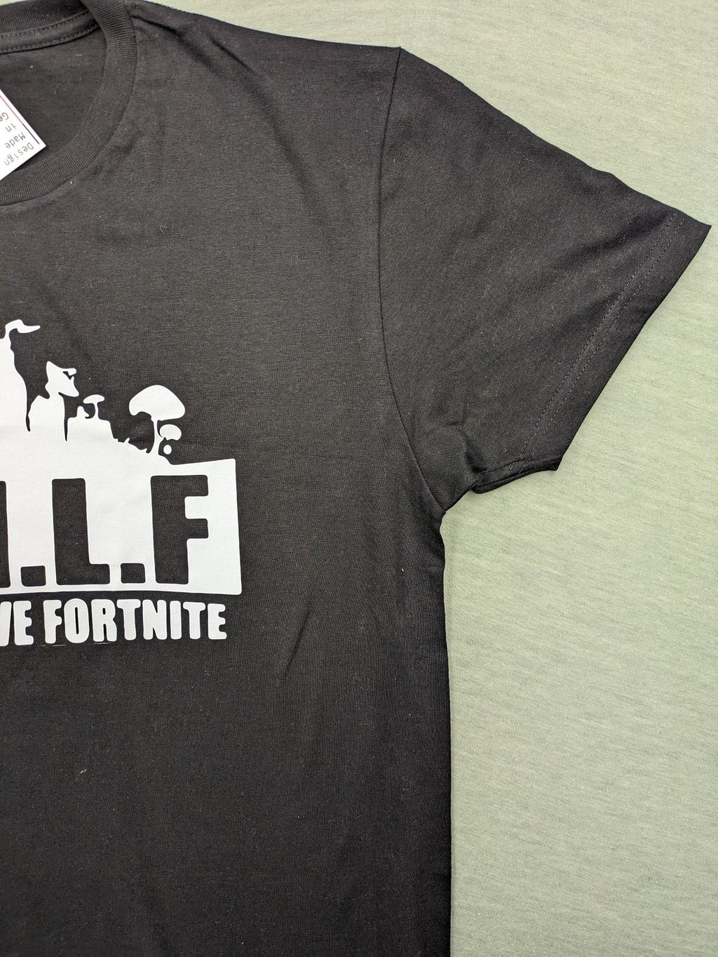 Fortnite black t-shirt with white "M.I.L.F. Man I Love Fortnite" graphic print.