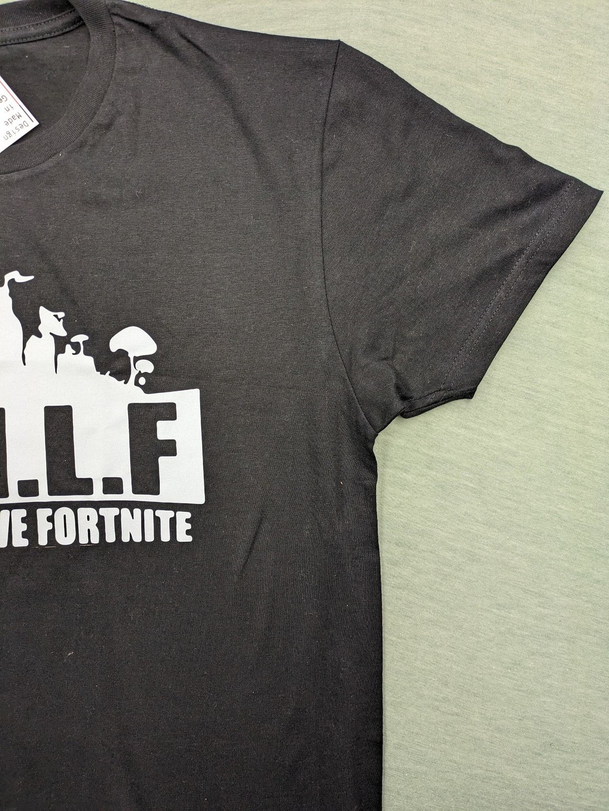 Fortnite black t-shirt with white "M.I.L.F. Man I Love Fortnite" graphic print.