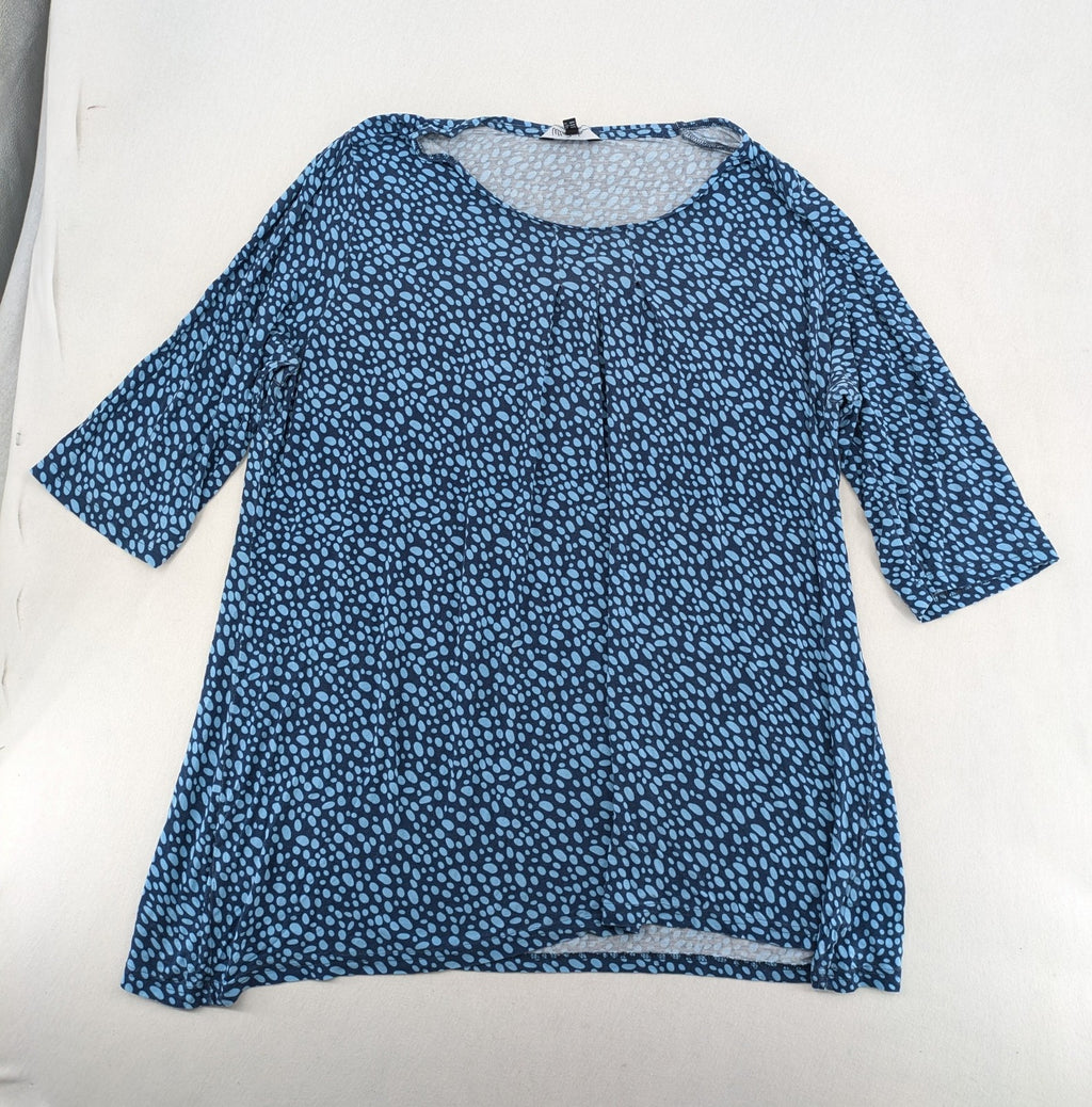 Ulla Popken blue tunic top with light blue polka dots and A-line cut.
