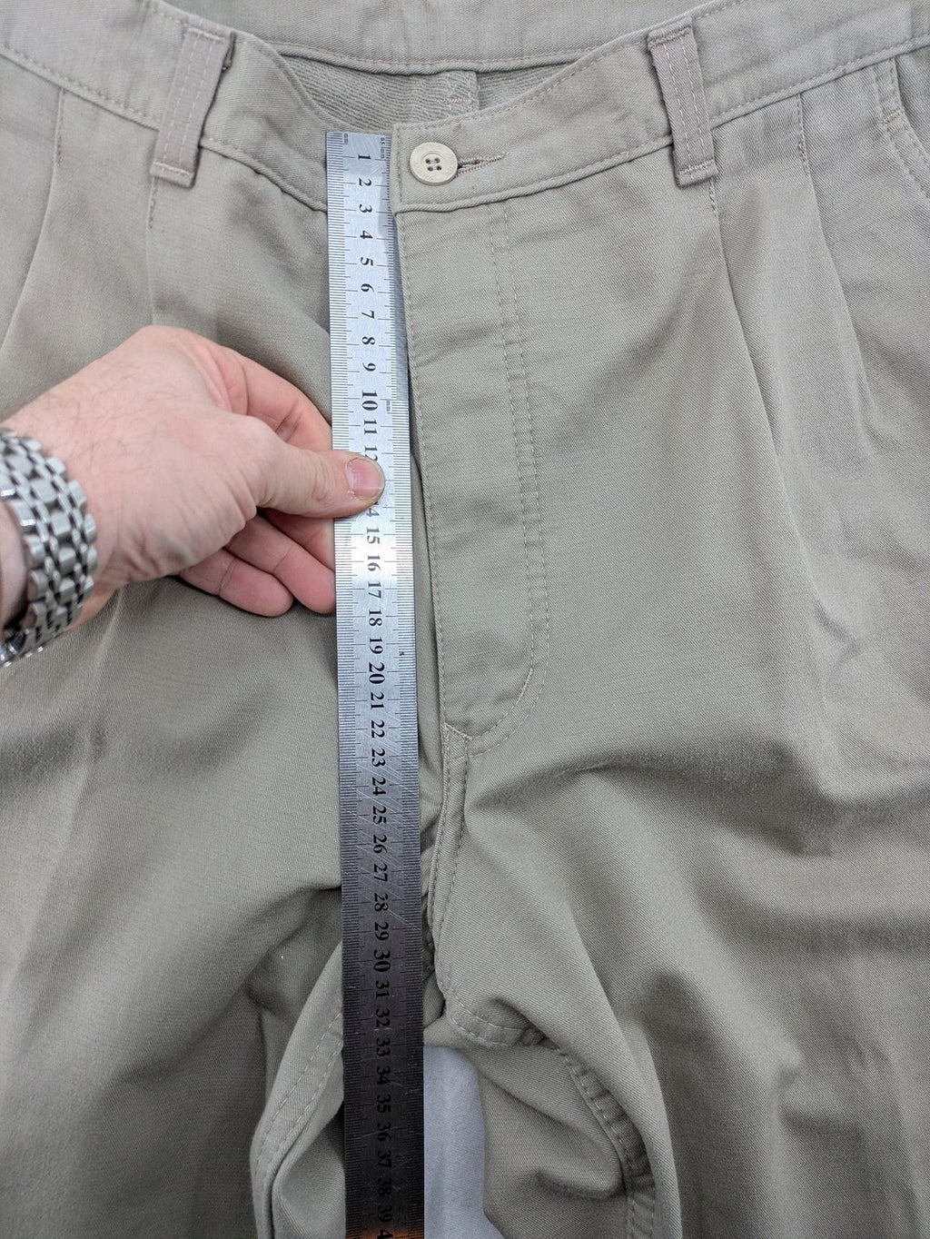 Pioneer beige chino trousers with pleats, straight leg, and buttoned back pocket.
