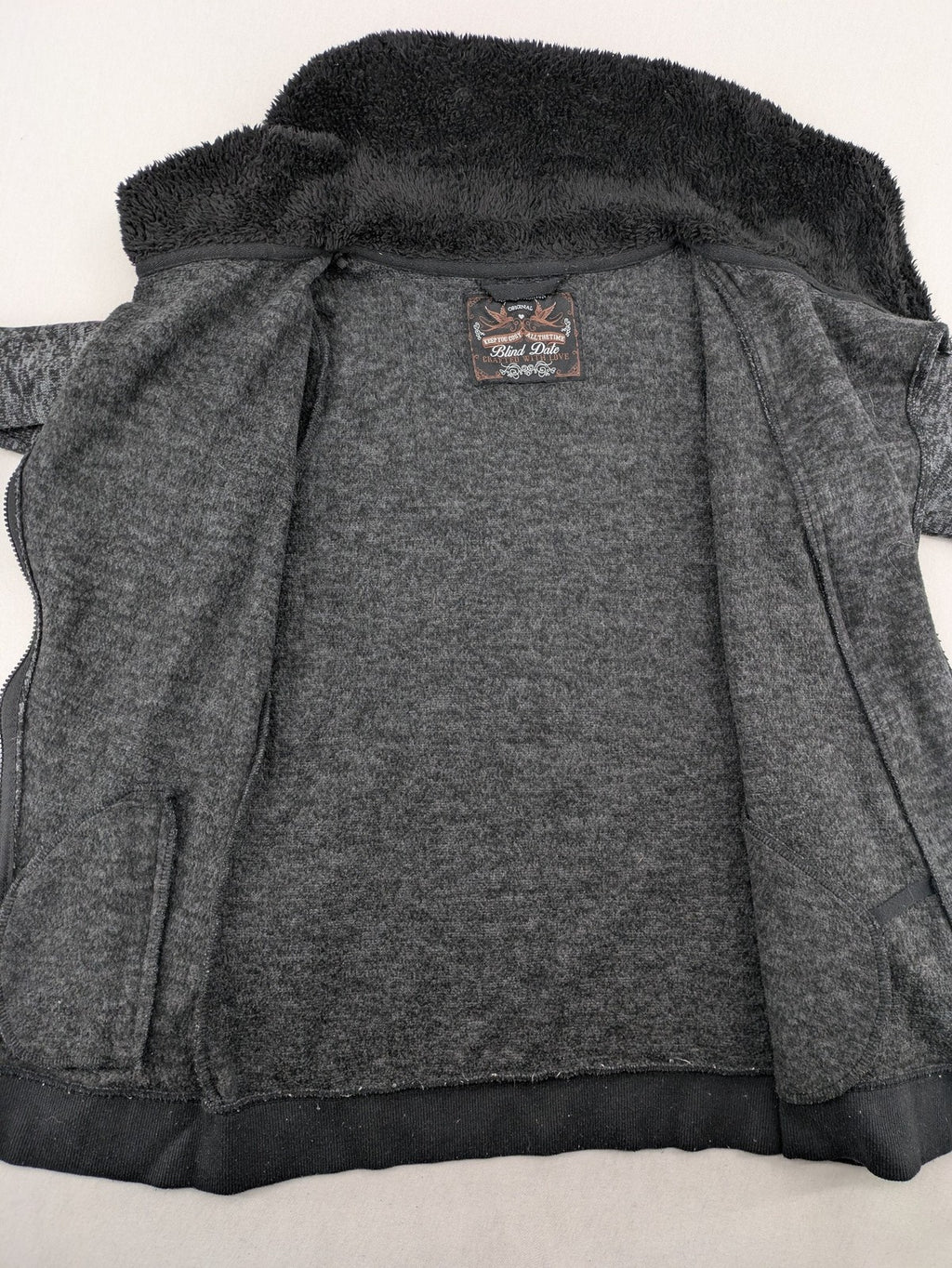 BLIND DATE grey asymmetrical zip hoodie with high fleece-lined waterfall collar.