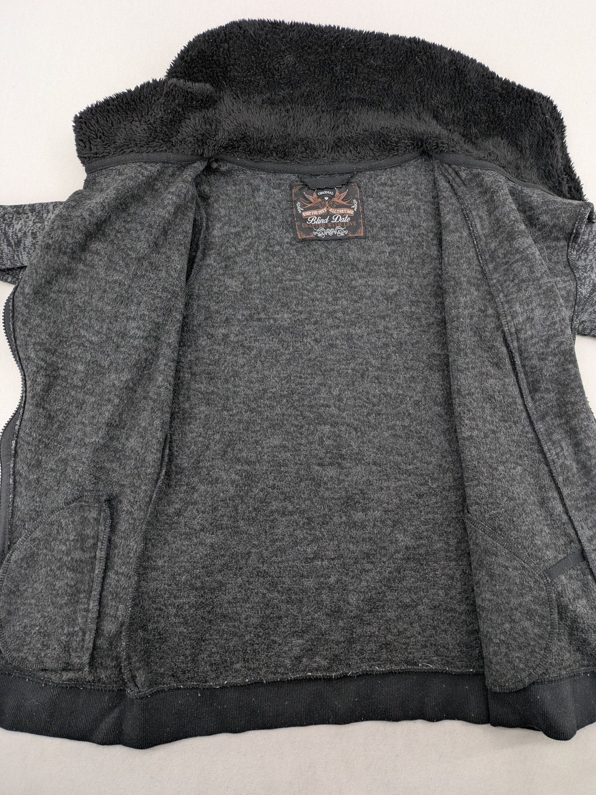 BLIND DATE grey asymmetrical zip hoodie with high fleece-lined waterfall collar.