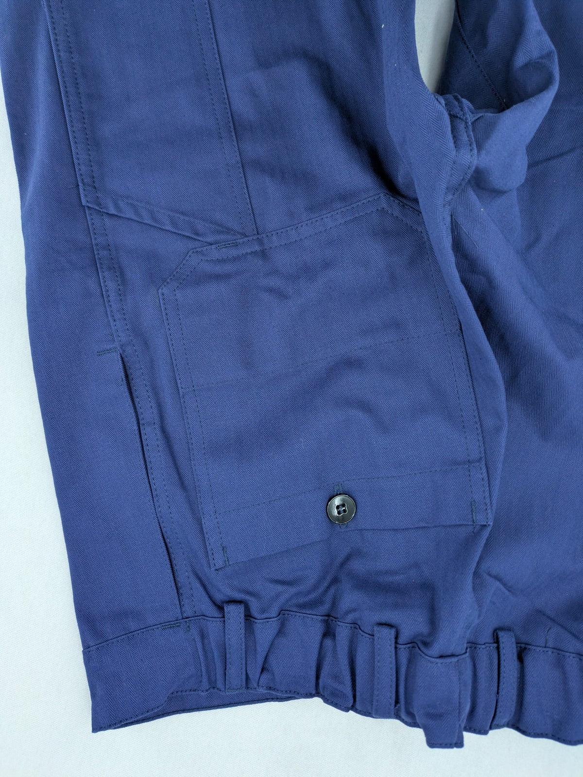 Uvex navy work trousers 100% cotton with button closure and belt loops.