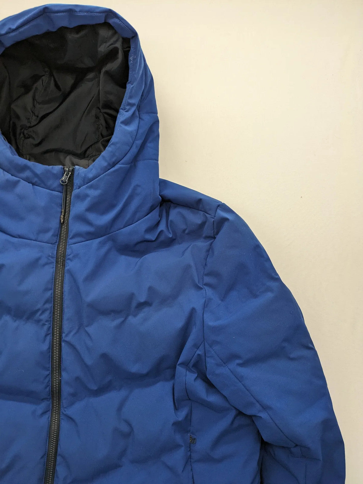 C&A blue winter jacket with hood, zip closure, and multiple pockets, used condition.
