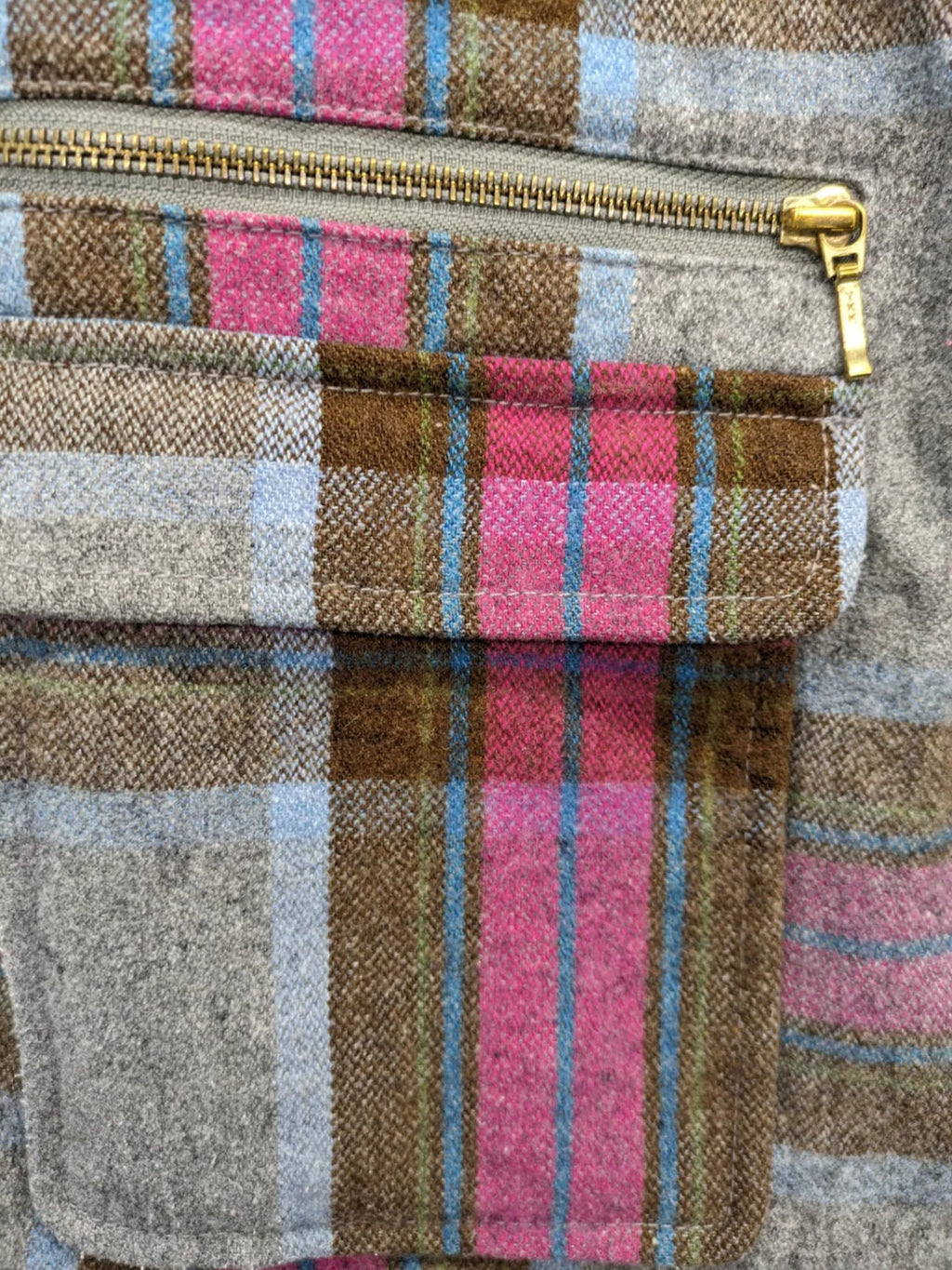 Johnnie B pink coat with gray check pattern, Sherpa lining, and zip closure.