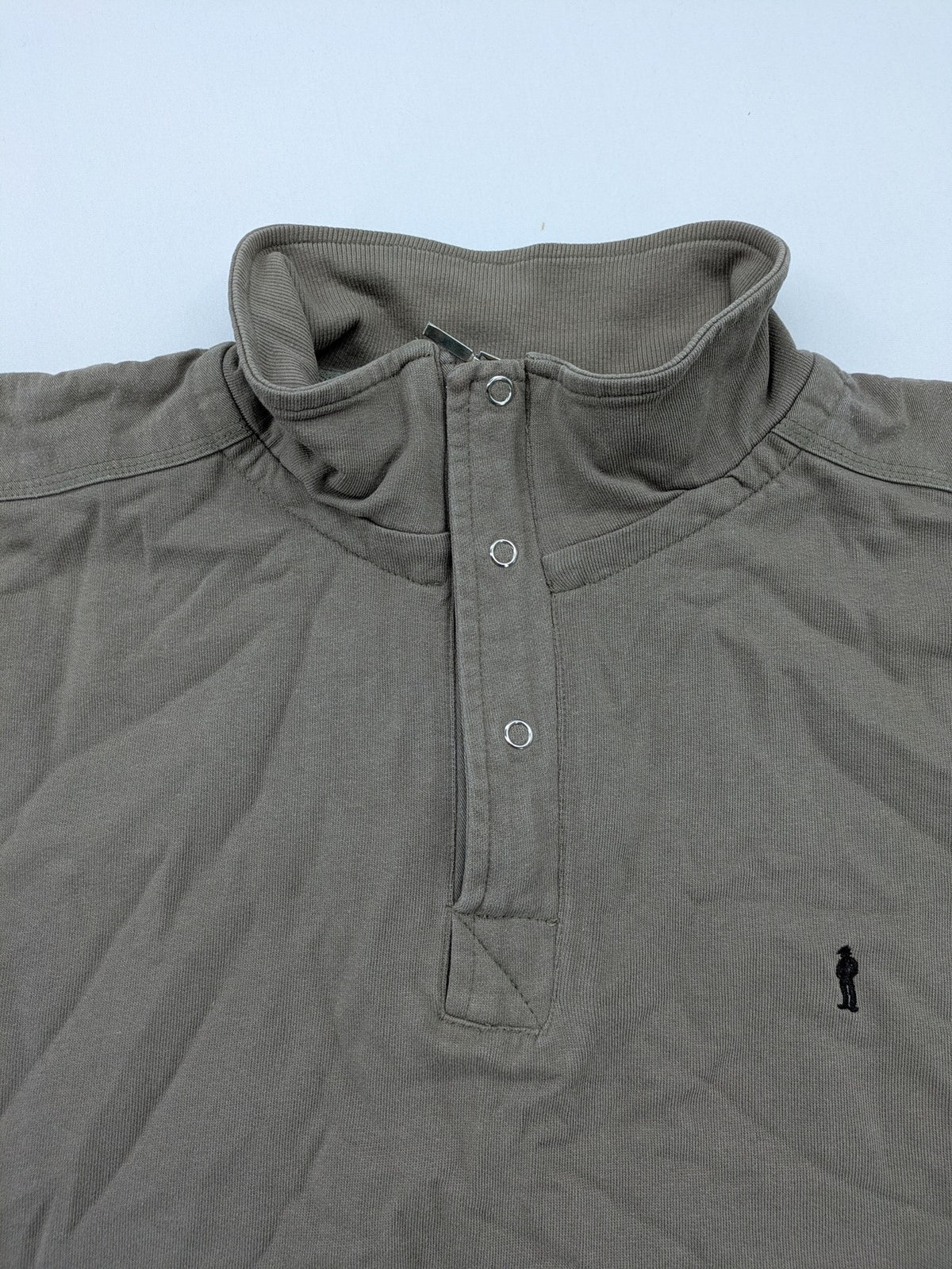 Tony Brown brown turtle neck jumper with embroidered logo and zip button placket.