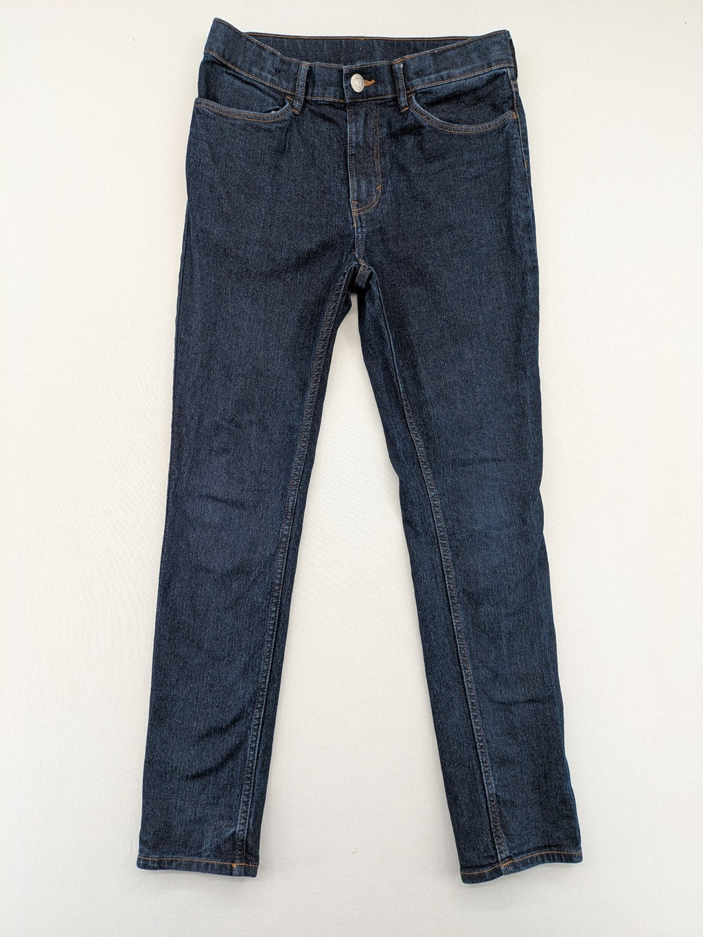 H&M blue skinny fit jeans with classic 5-pocket style and button closure.