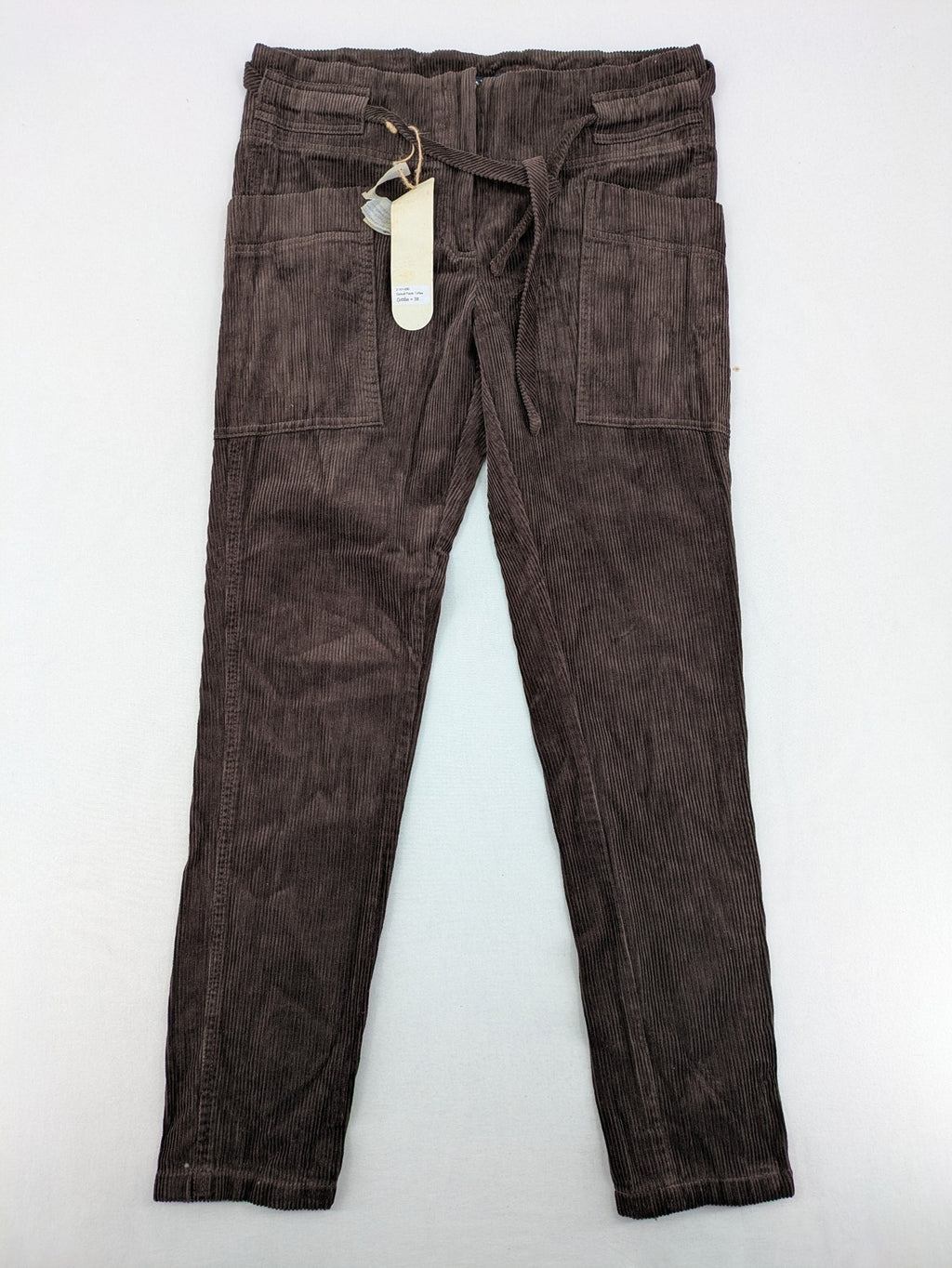 Alma & Lovis cream cord pants high-waist with matching belt and front pockets.