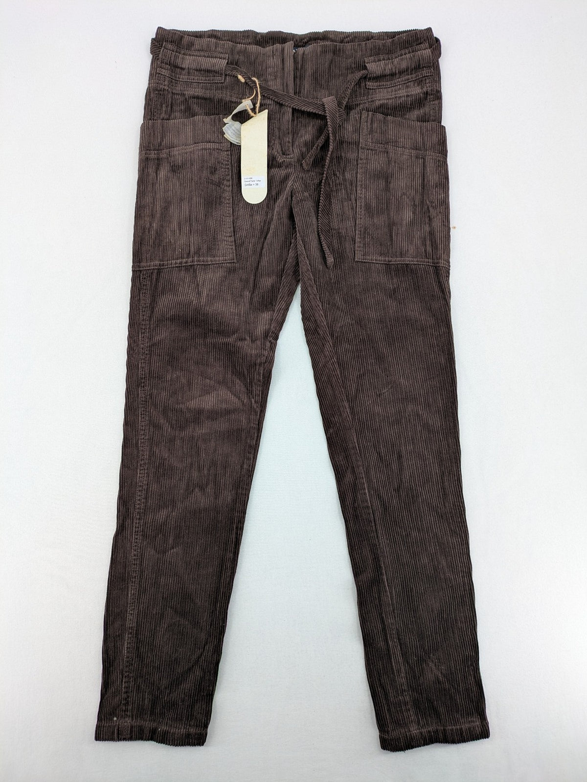 Alma & Lovis cream cord pants high-waist with matching belt and front pockets.