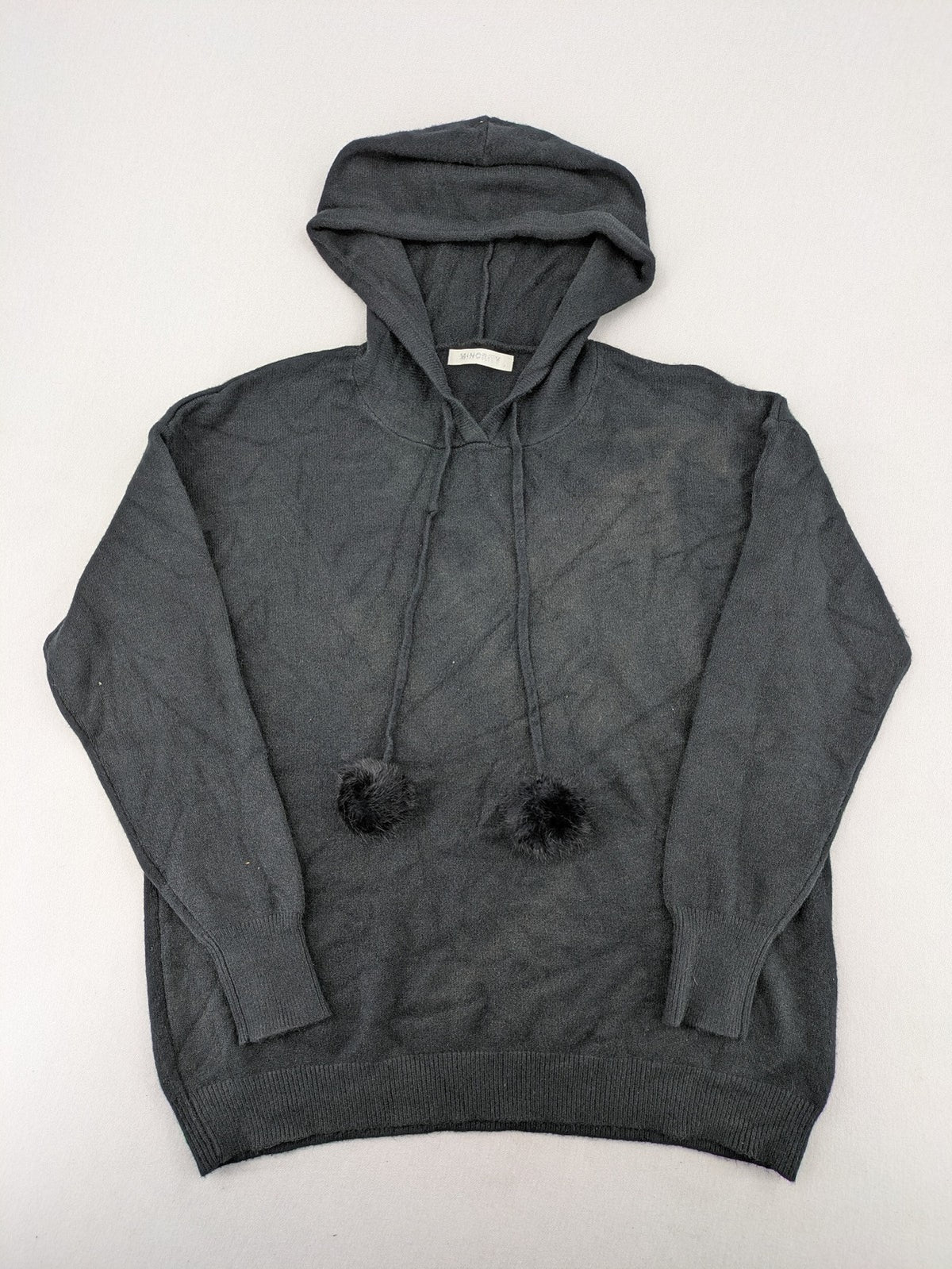 M/L grey hoodie with playful pom-poms and soft viscose blend material.