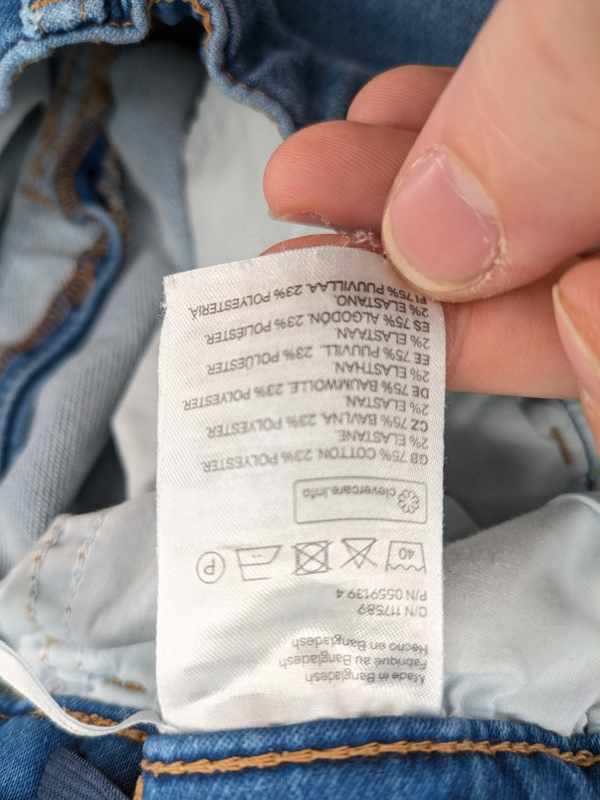 H&M blue straight jeans with elastic waistband and white drawstring, casual jogger style.