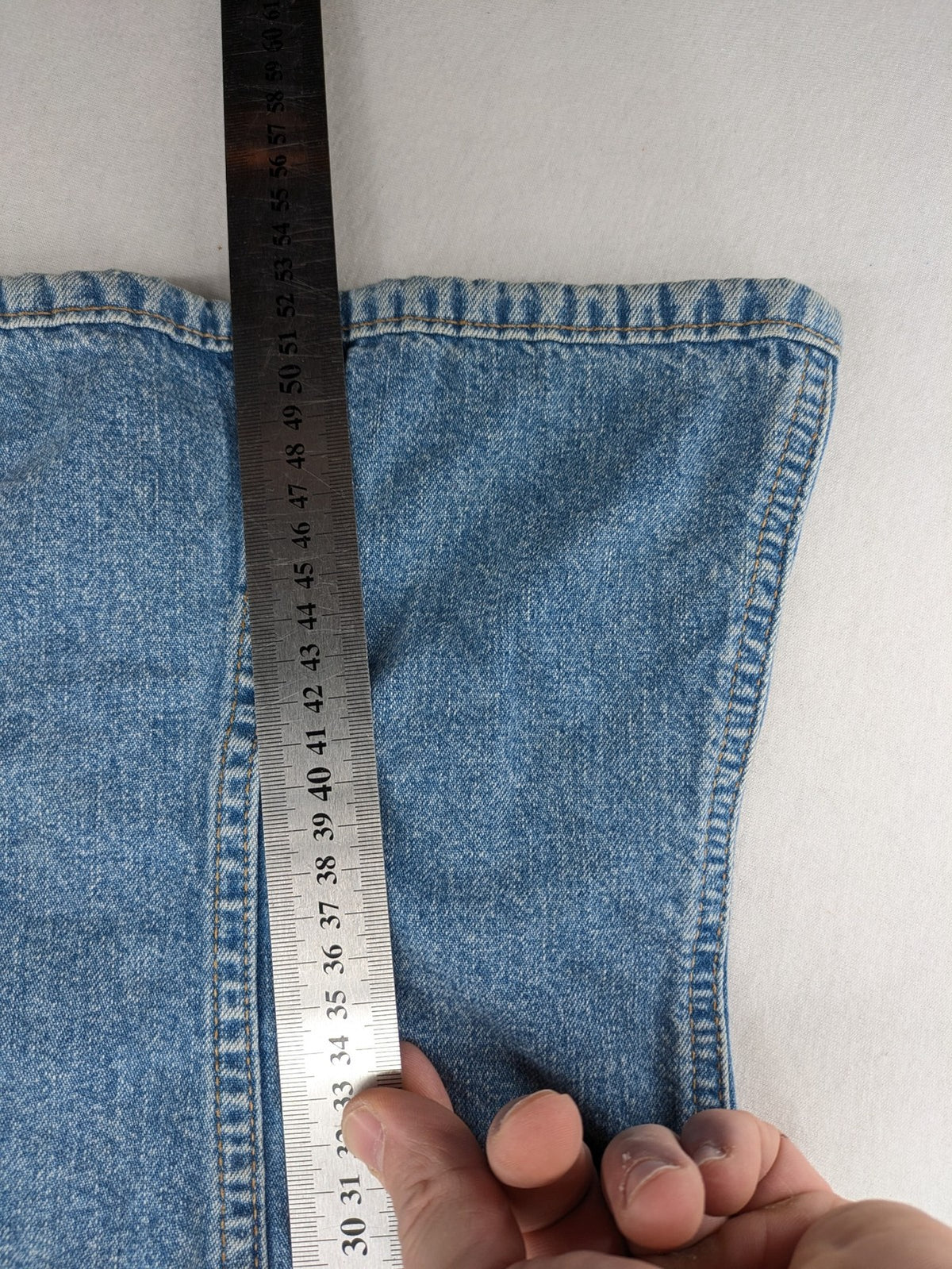 s.Oliver blue denim vest with button closure, pointed collar, and breast pockets.
