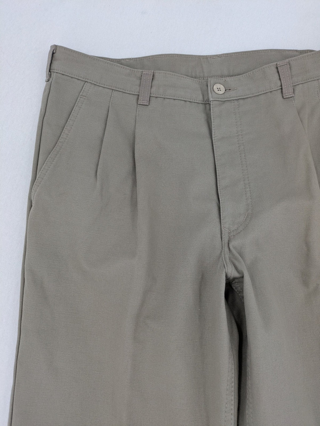 Pioneer beige chino trousers with pleats, straight leg, and buttoned back pocket.