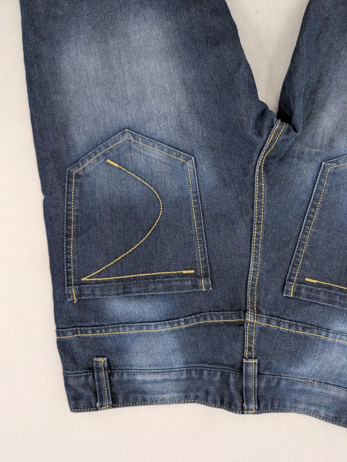 C&A blue straight leg jeans with classic 5-pocket design and faded wash details.