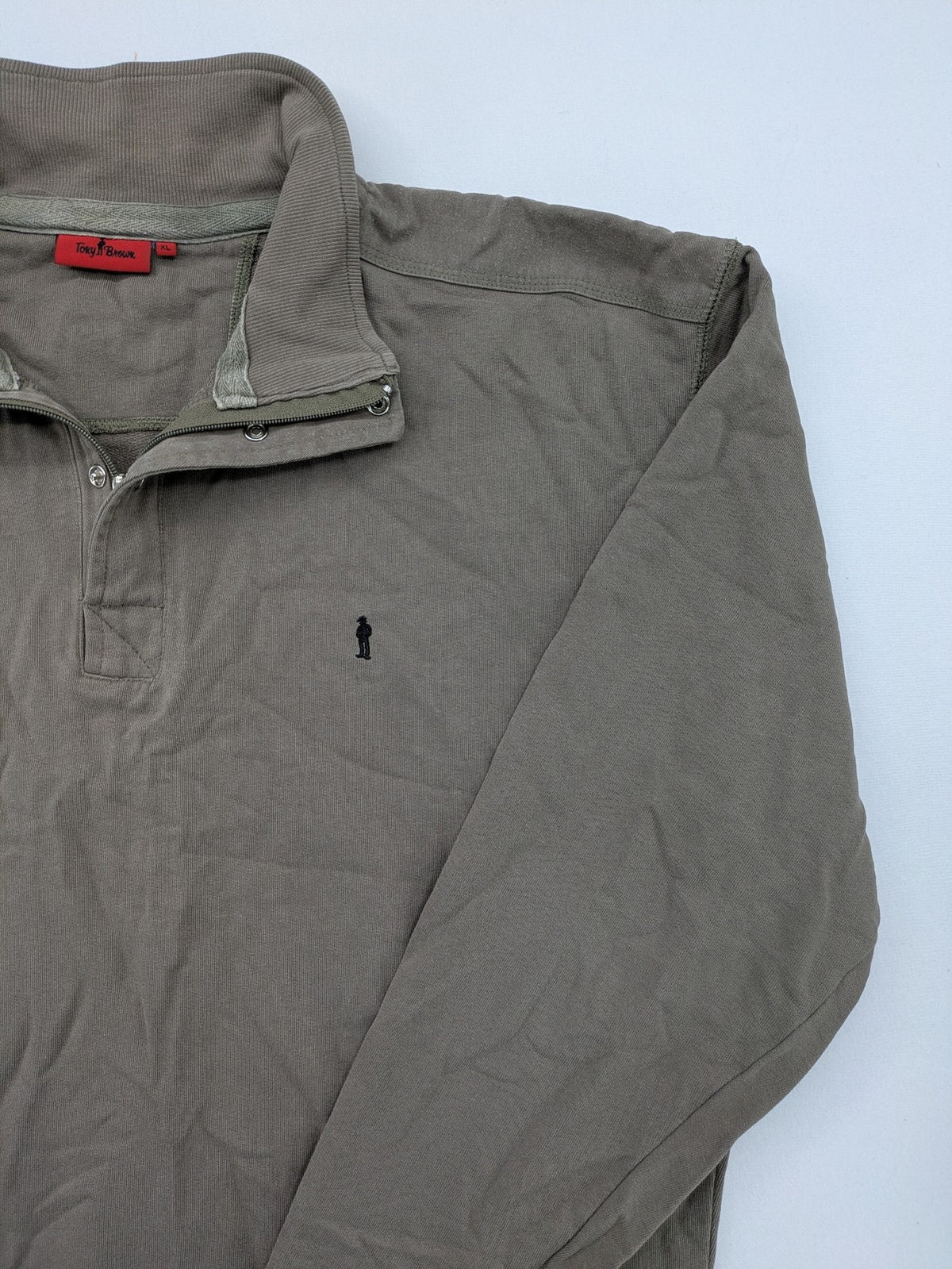 Tony Brown brown turtle neck jumper with embroidered logo and zip button placket.