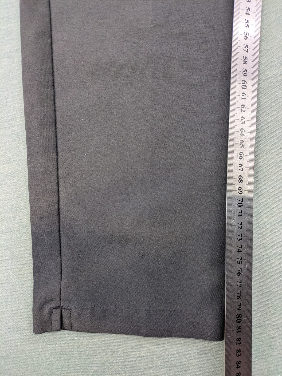 Adidas grey pants with 3-stripe logo, flat-front design, made from performance material.