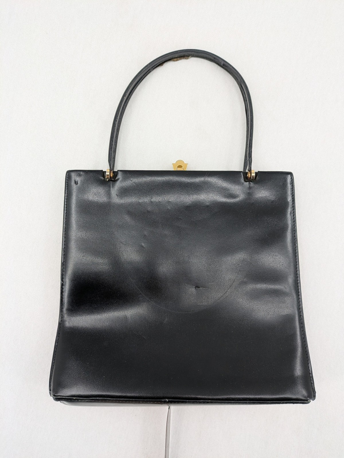 Eleganz black messenger bag vintage 50s 60s style with structured shape and gold accents.