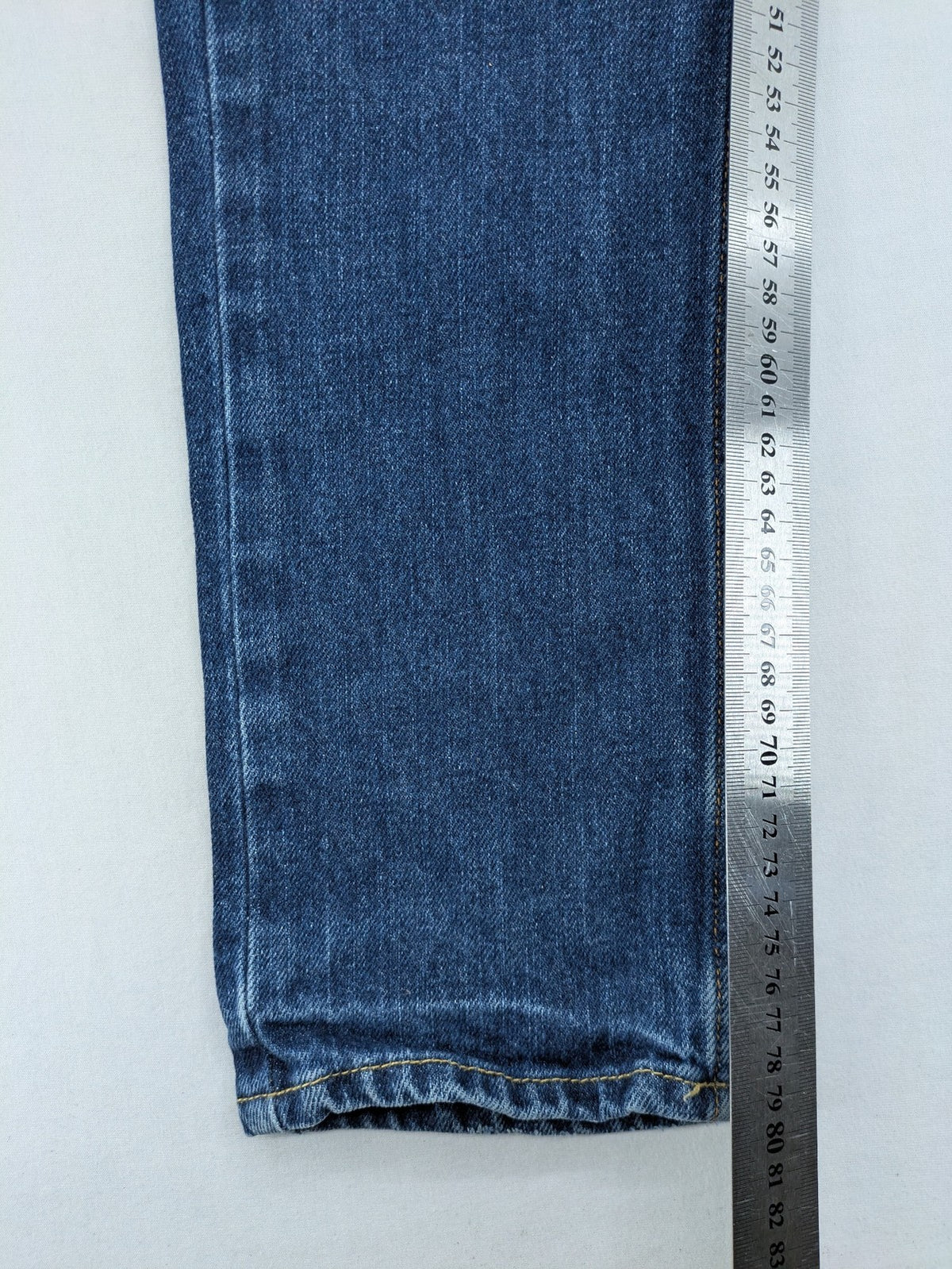 Hollister blue super skinny jeans medium wash button fly with faded details.