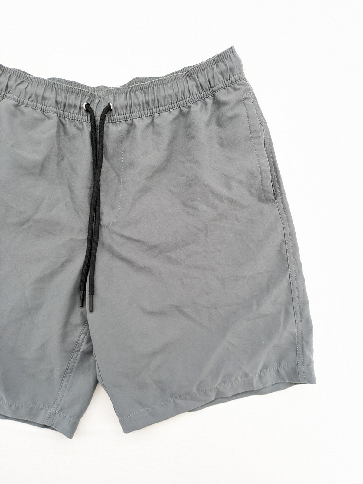 Amazon Essentials grey swim shorts with adjustable drawstring, side pockets, and quick-dry material.