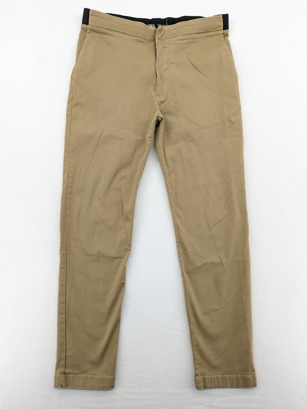 Zara khaki pants with elastic waistband, made from stretch cotton blend for comfort.