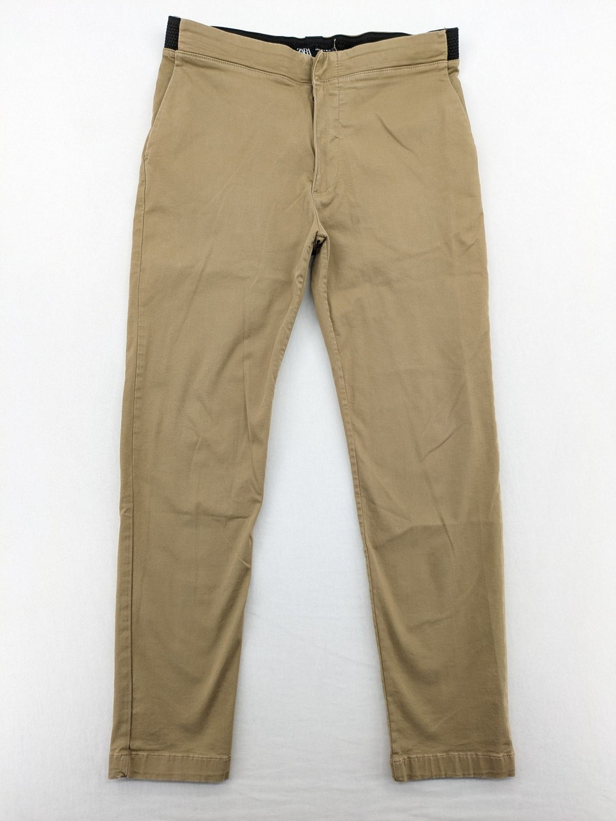 Zara khaki pants with elastic waistband, made from stretch cotton blend for comfort.