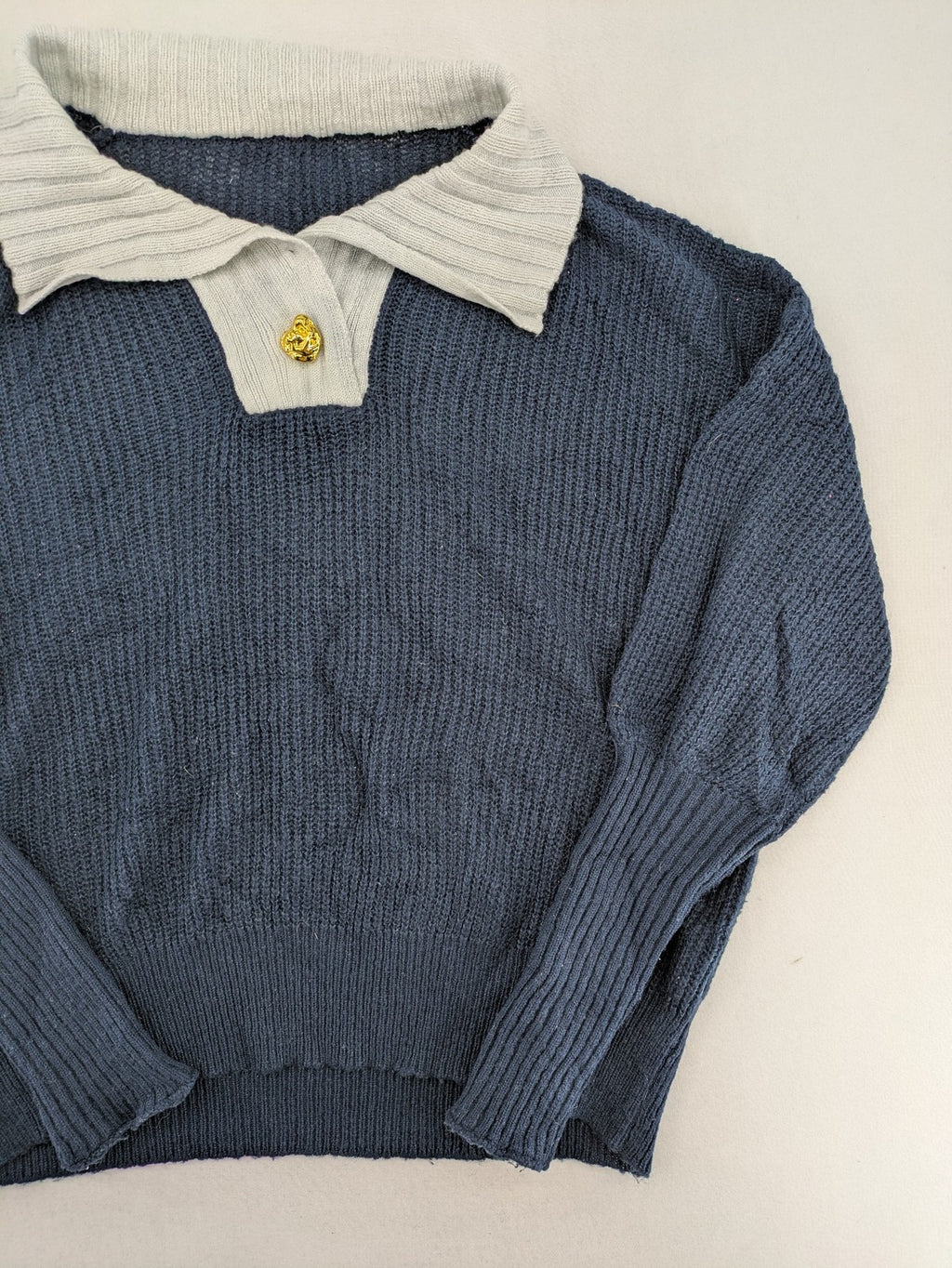 Dazy navy turtle neck jumper with contrasting collar and gold heart button detail.