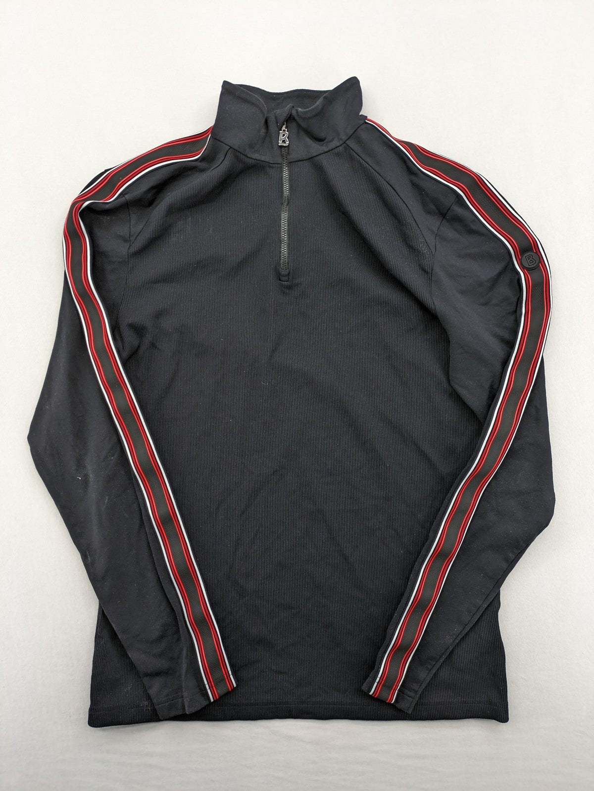 Bogner black turtle neck jumper with red and white striped sleeves and 1/4 zipper.