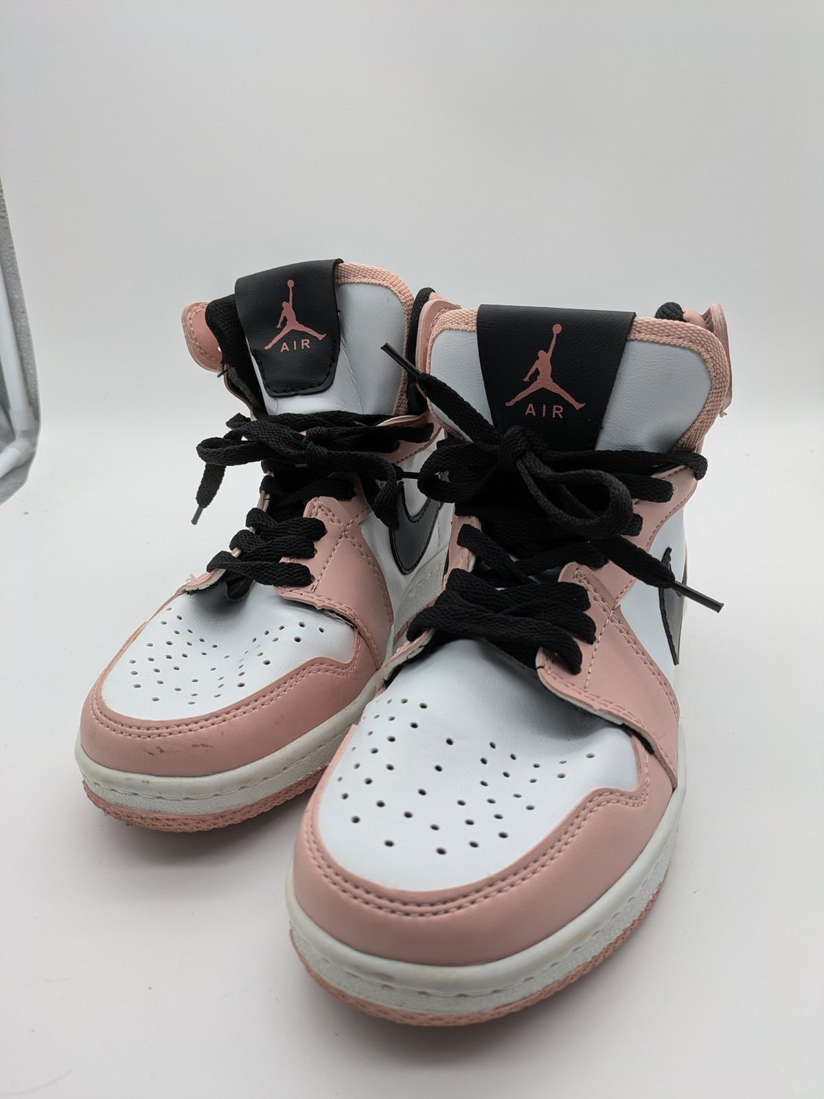 Nike Air Jordan high-top sneakers multi with Wings logo, Jumpman detail, and perforated toe.