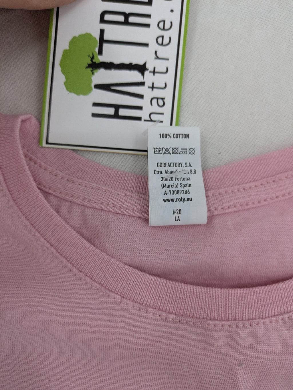 Marilyn Manson pink band t-shirt with colorful graphic portrait and "MM" logo.