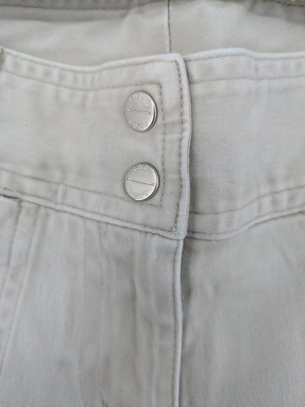 H&M L.O.G.G beige bootcut pants with double button closure and stretch cotton material.
