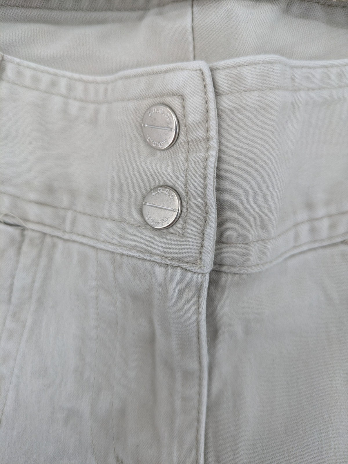 H&M L.O.G.G beige bootcut pants with double button closure and stretch cotton material.