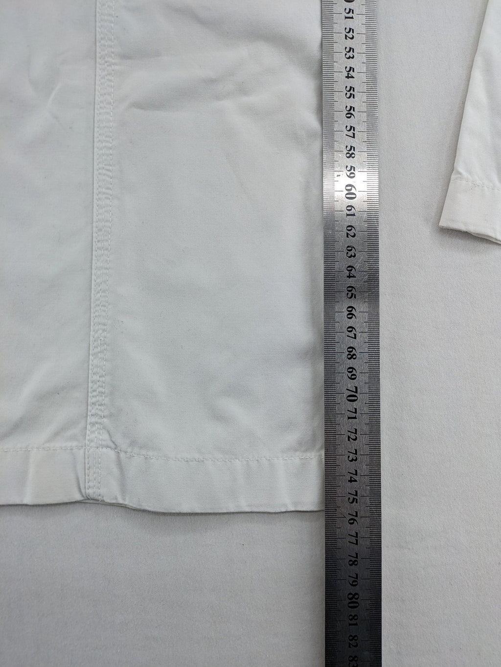 Street One white cargo pants with side pockets and wide leg design.