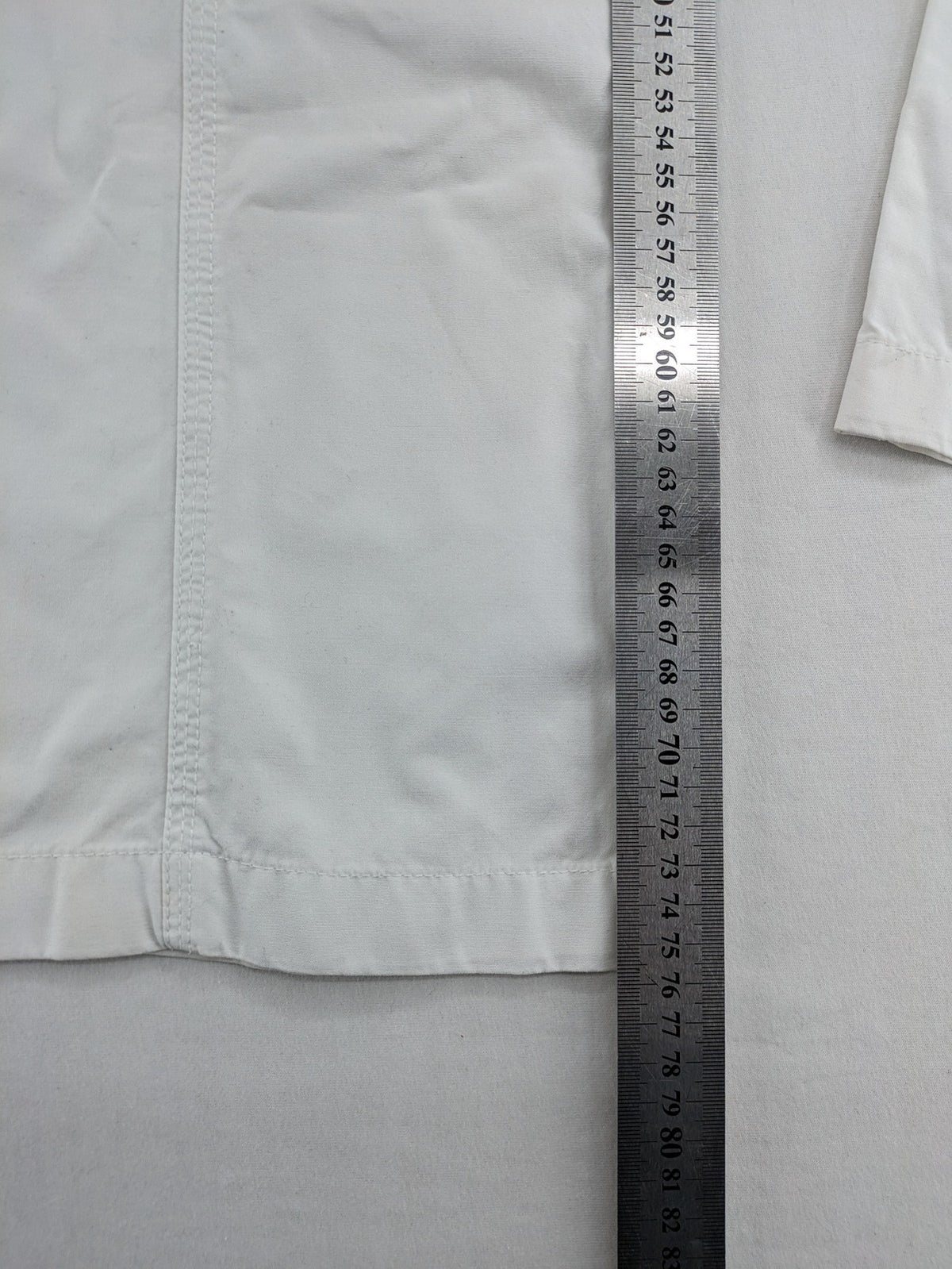 Street One white cargo pants with side pockets and wide leg design.
