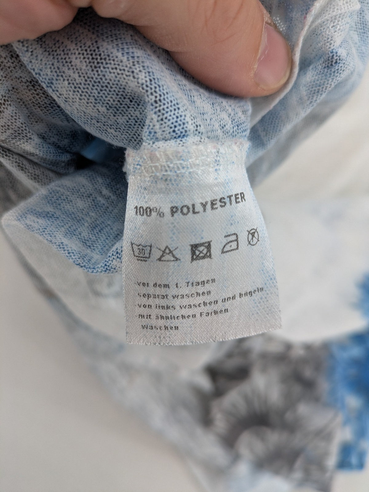 Liberty blue floral print top with metallic "LOVE" lettering, lightweight polyester material.